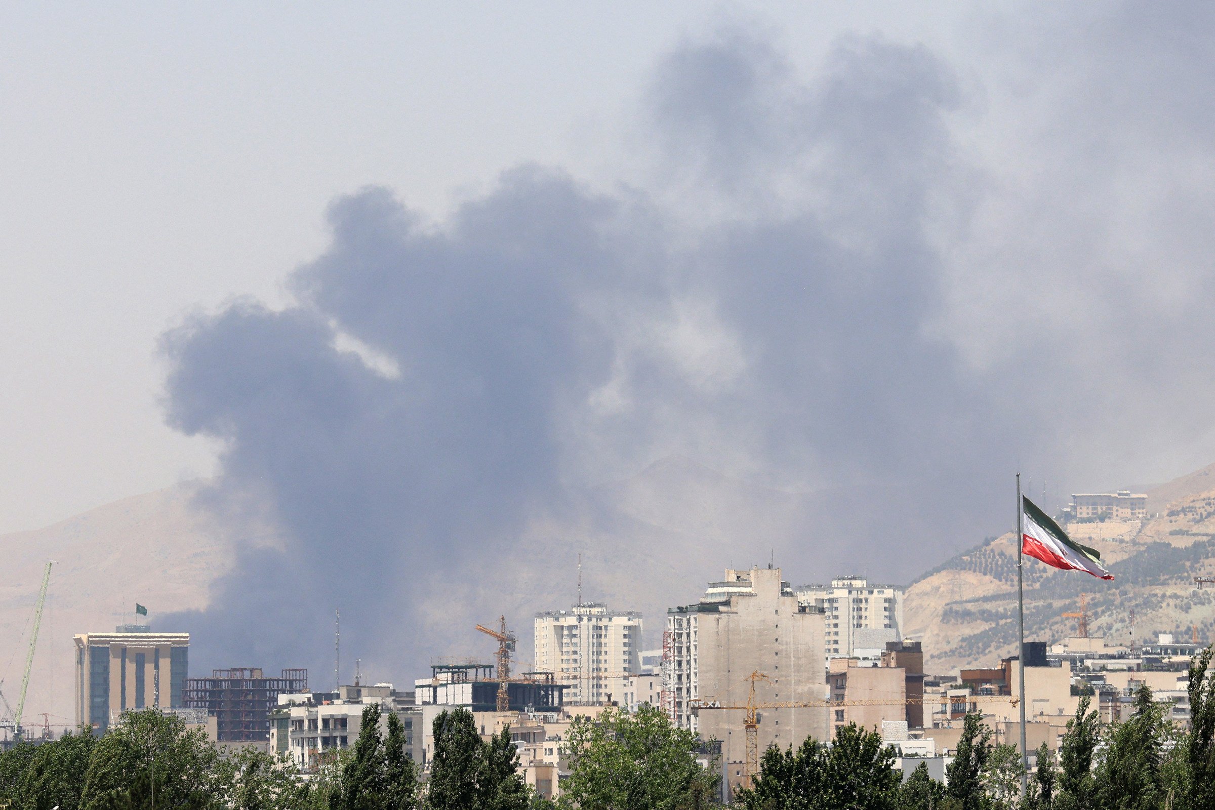 Smoke billows from Iran’s Shahran oil depot, northwest of Tehran, on June 16. Photo: AFP via Getty Images/TNS