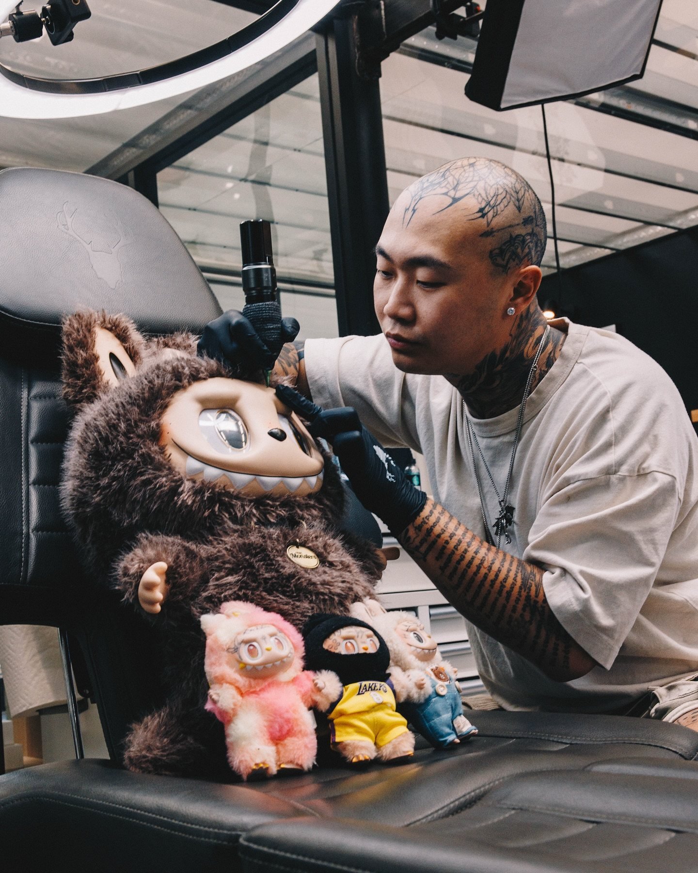 Tattoo artist Hunter Chao works on a “Tabubu”, his line of tattooed Labubu toys that typically sell for between US$170 and US$200. Photo: Hunter Chao/Bryam Heredia