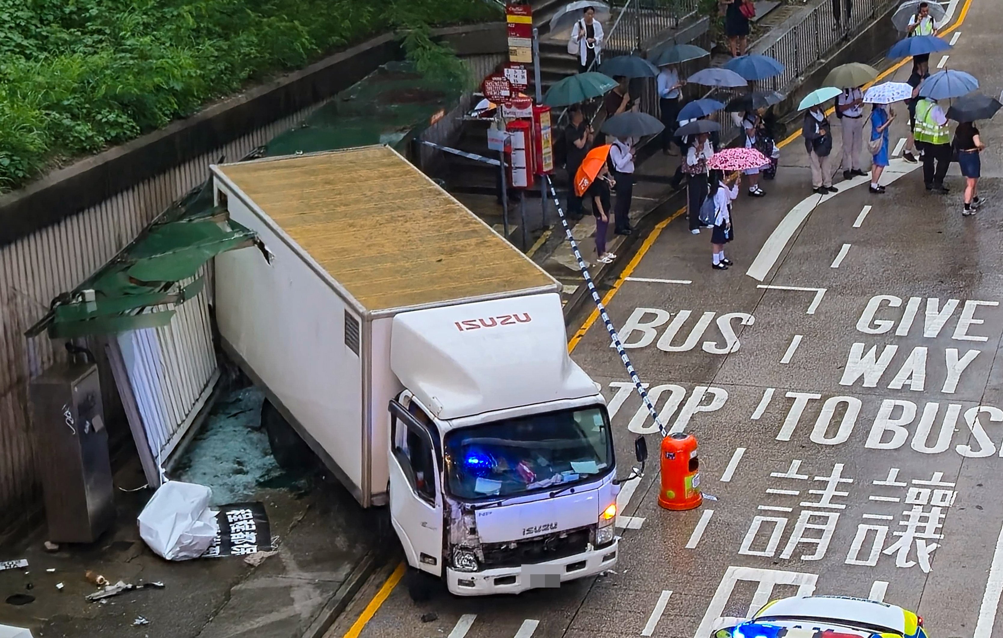 A woman has died after being trapped under a truck that crashed into a bus stop. Photo: Handout