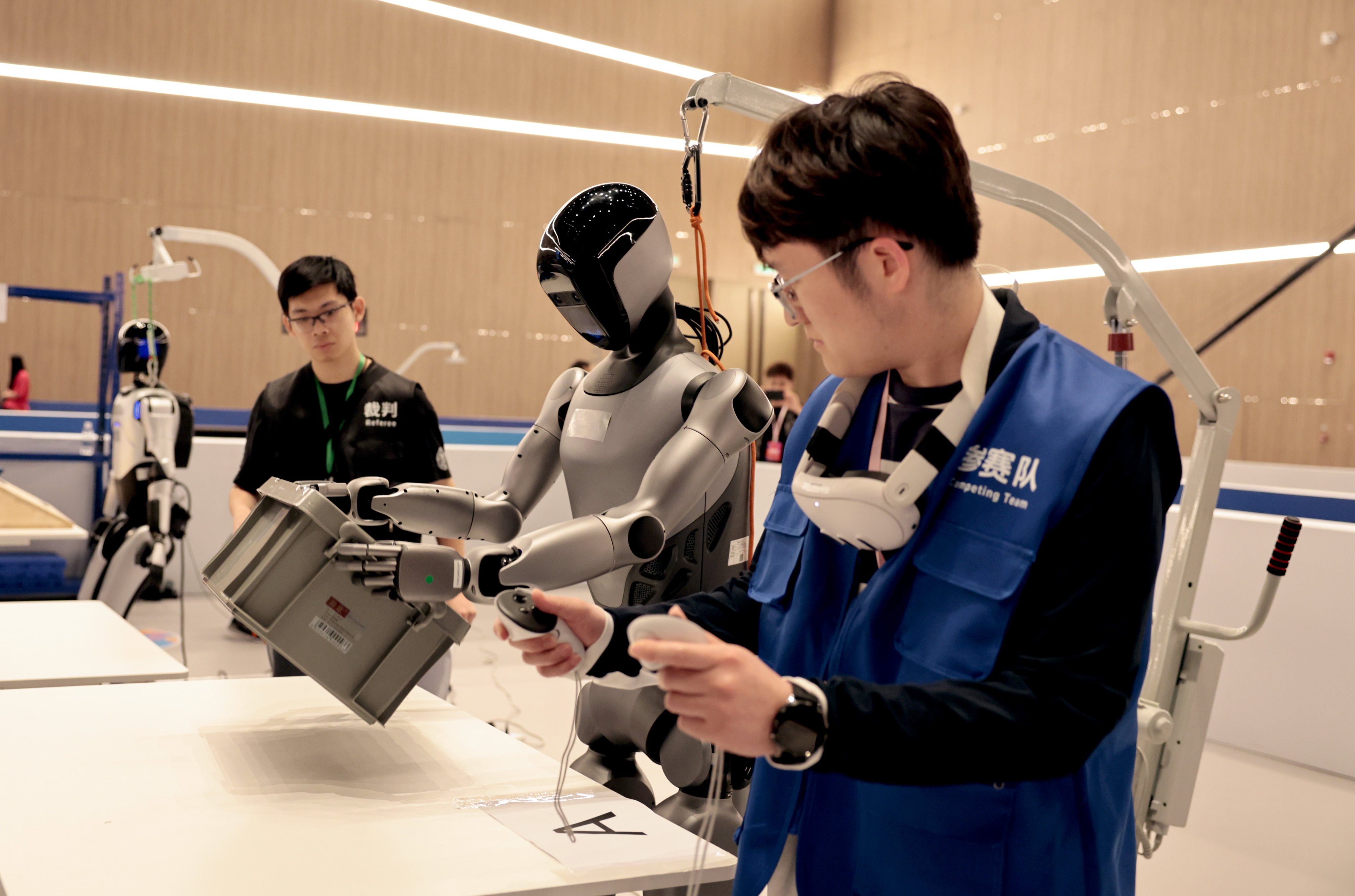 A robot competes in a feedbox handling contest during the 2025 International Humanoid Robot Skills Competition held at Zhangjiang Science Hall in Shanghai, China, on May 29, 2025. Photo: Xinhua