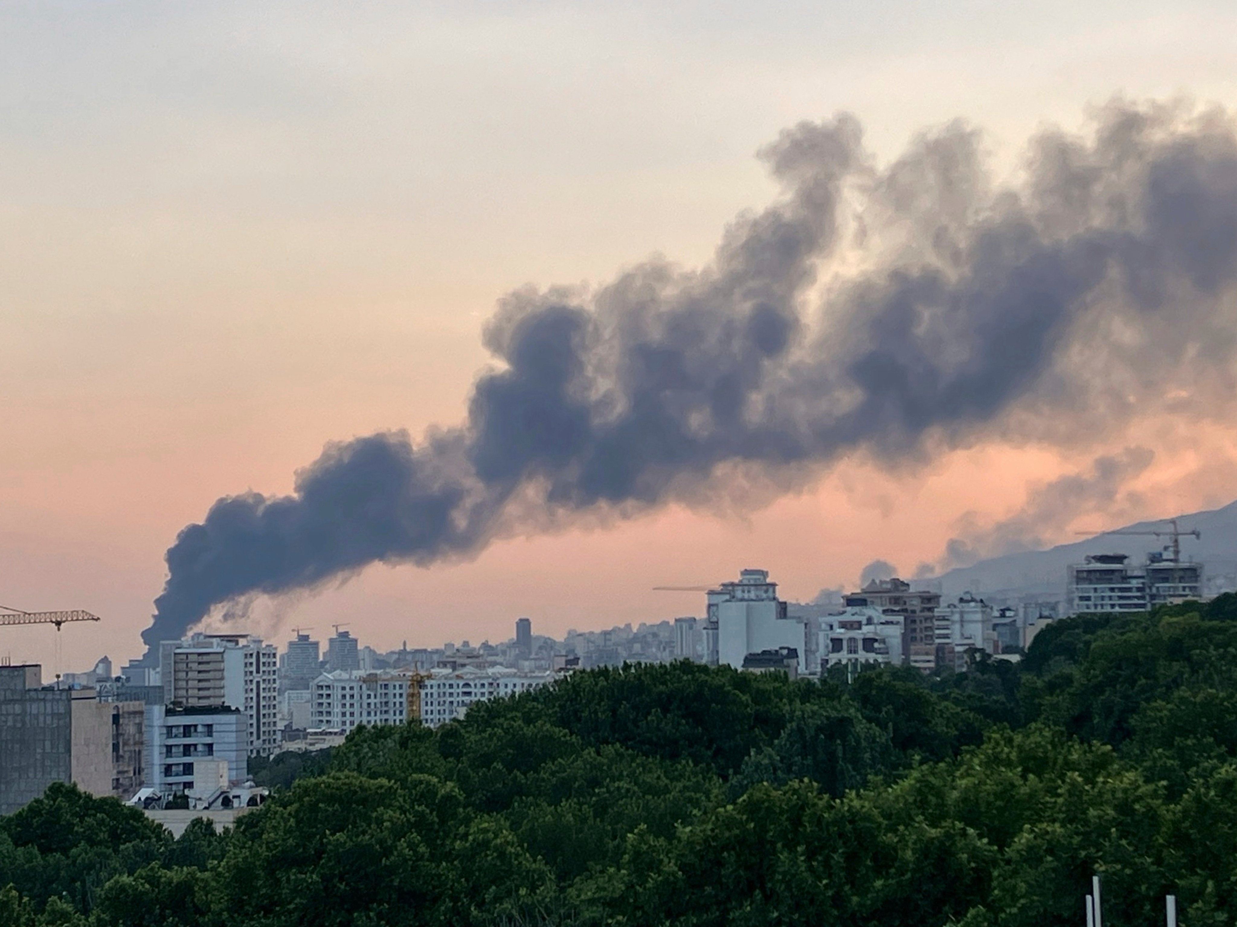Smoke rises from the building of Iran’s state-run television after an Israeli strike in Tehran, Iran, on Monday. Photo: AP