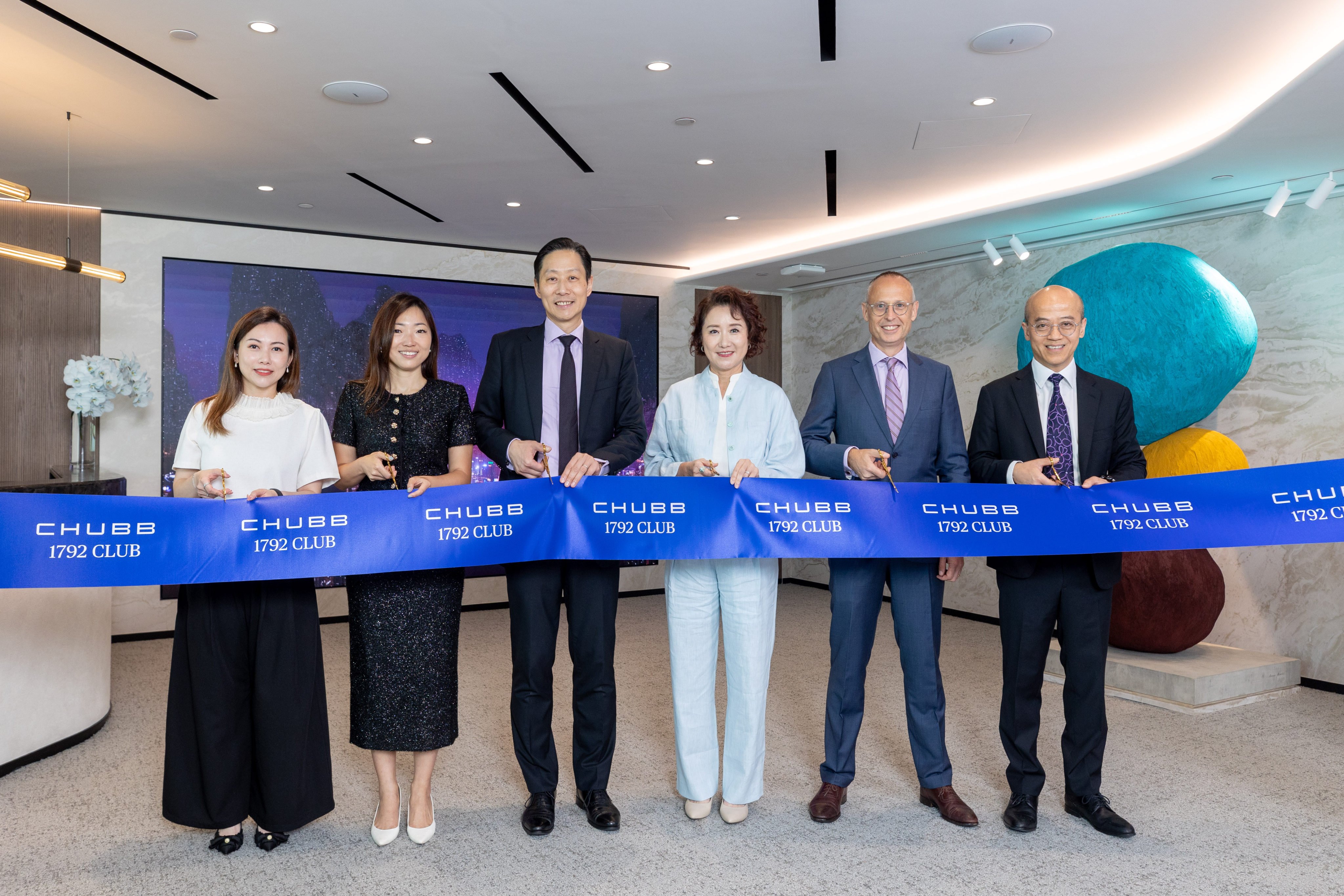 Cutting the ribbon on the Chubb 1792 Club wealth centre are (from left) Joan Tam, head of brokerage, Chubb Life Hong Kong; Ivy Cheung, chief marketing officer, Chubb Life Hong Kong; Eric Ng Tung-hing, global chief financial officer, Chubb Life; Belinda Au, president of Hong Kong and head of North Asia, Chubb Life Hong Kong; Bryce Johns, global president, Chubb Life; and William Man, chief operation officer, Chubb Life Hong Kong.