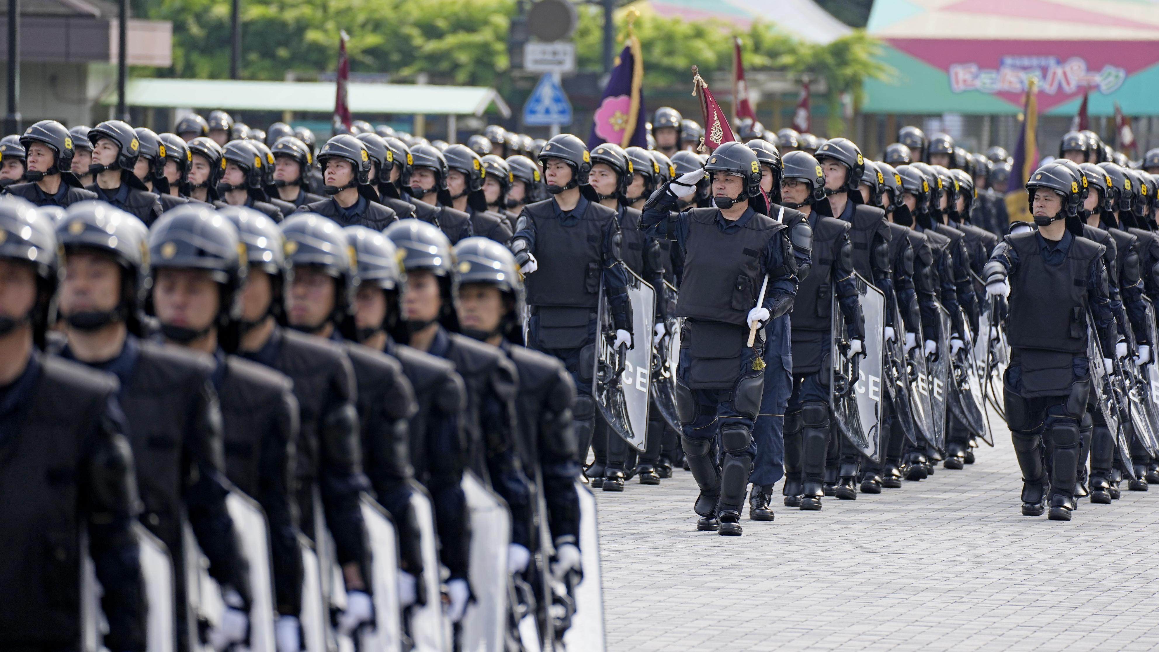 Members of the Tokyo Metropolitan Police Department’s riot squad march during an inspection ceremony in the Japanese capital last month. Photo: Kyodo