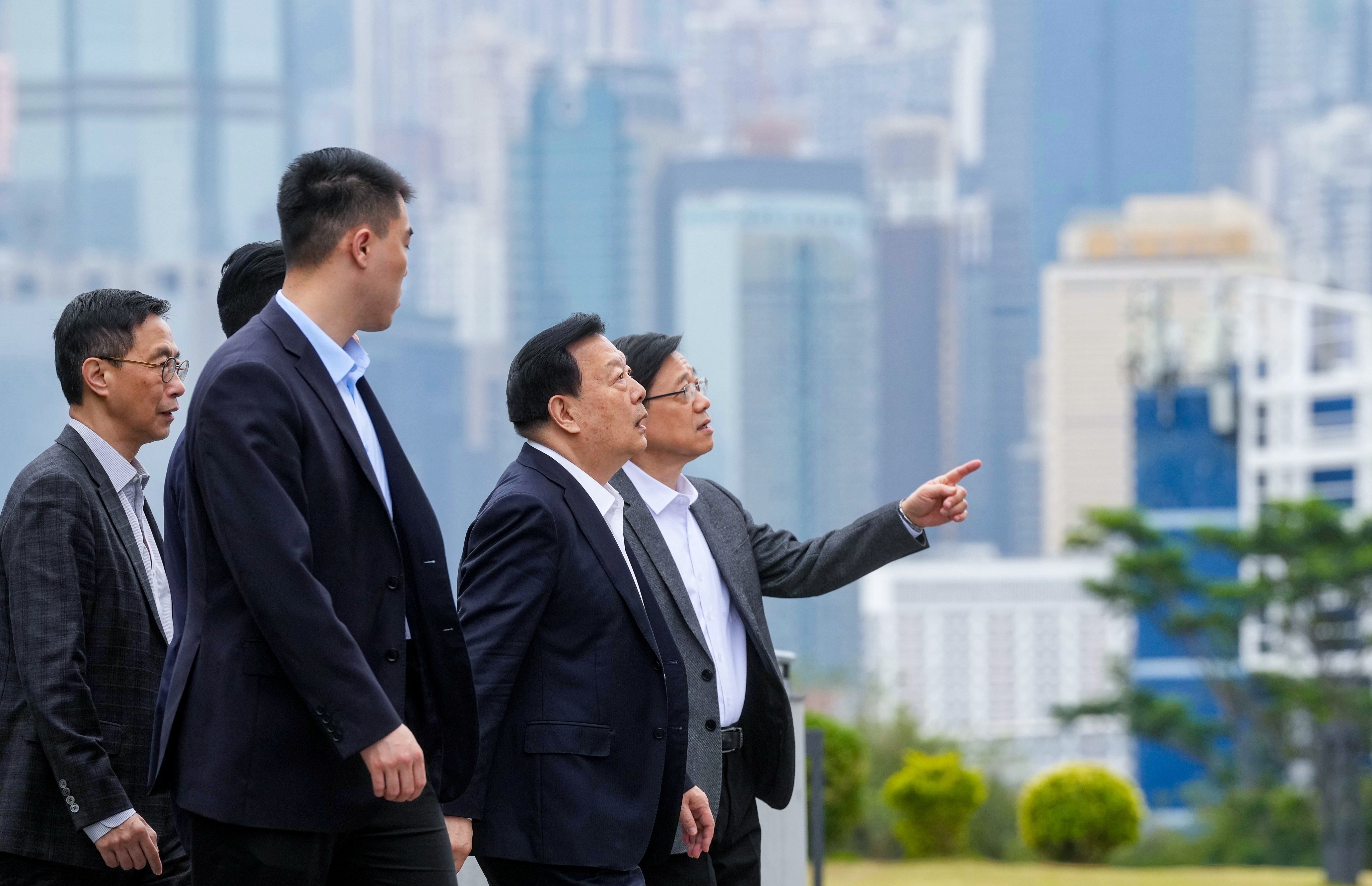 City leader John Lee (right) has confirmed that Xia Baolong (second from right) will visit Hong Kong for five days, beginning on Wednesday. Photo: Elson Li