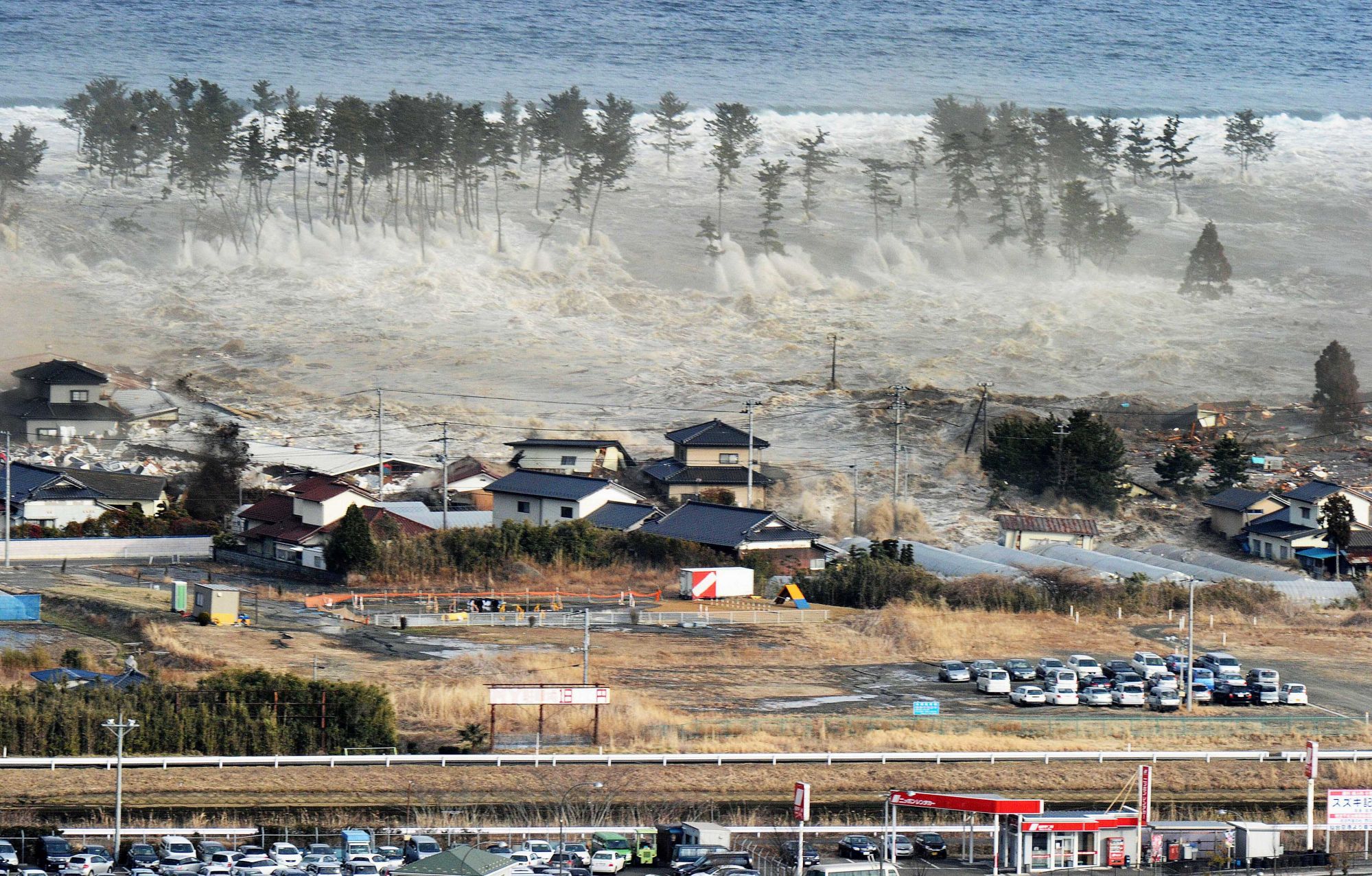 Waves of a tsunami hit residences after a powerful earthquake in Natori, Miyagi prefecture on March 11, 2011. Photo: AP Waves of a tsunami hit residences after a powerful earthquake in Natori, Miyagi prefecture on March 11, 2011. Photo: AP