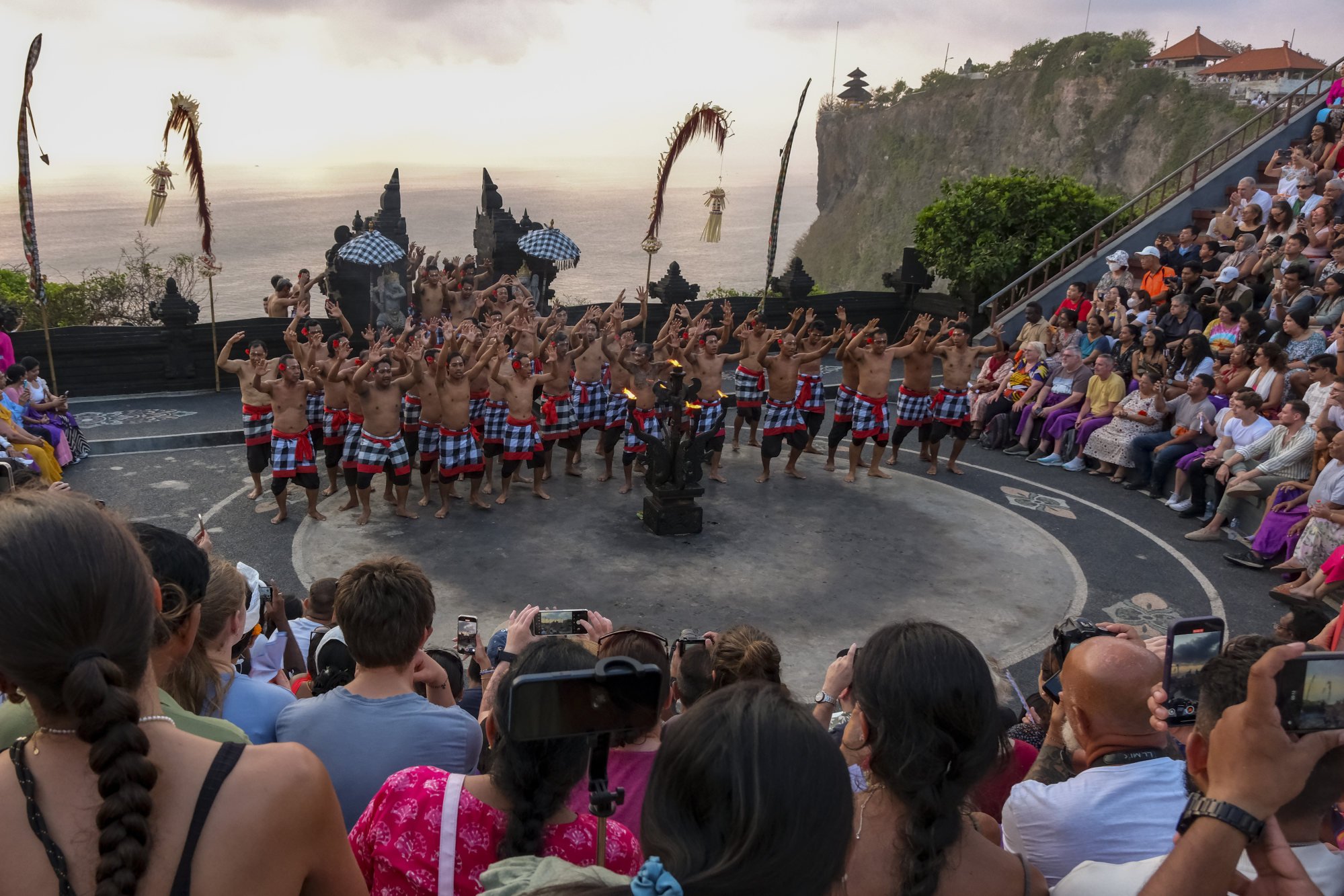 Tourists watch a performance of Bali’s iconic Kecak dance. Photo: Anadolu via Getty Images Tourists watch a performance of Bali’s iconic Kecak dance. Photo: Anadolu via Getty Images