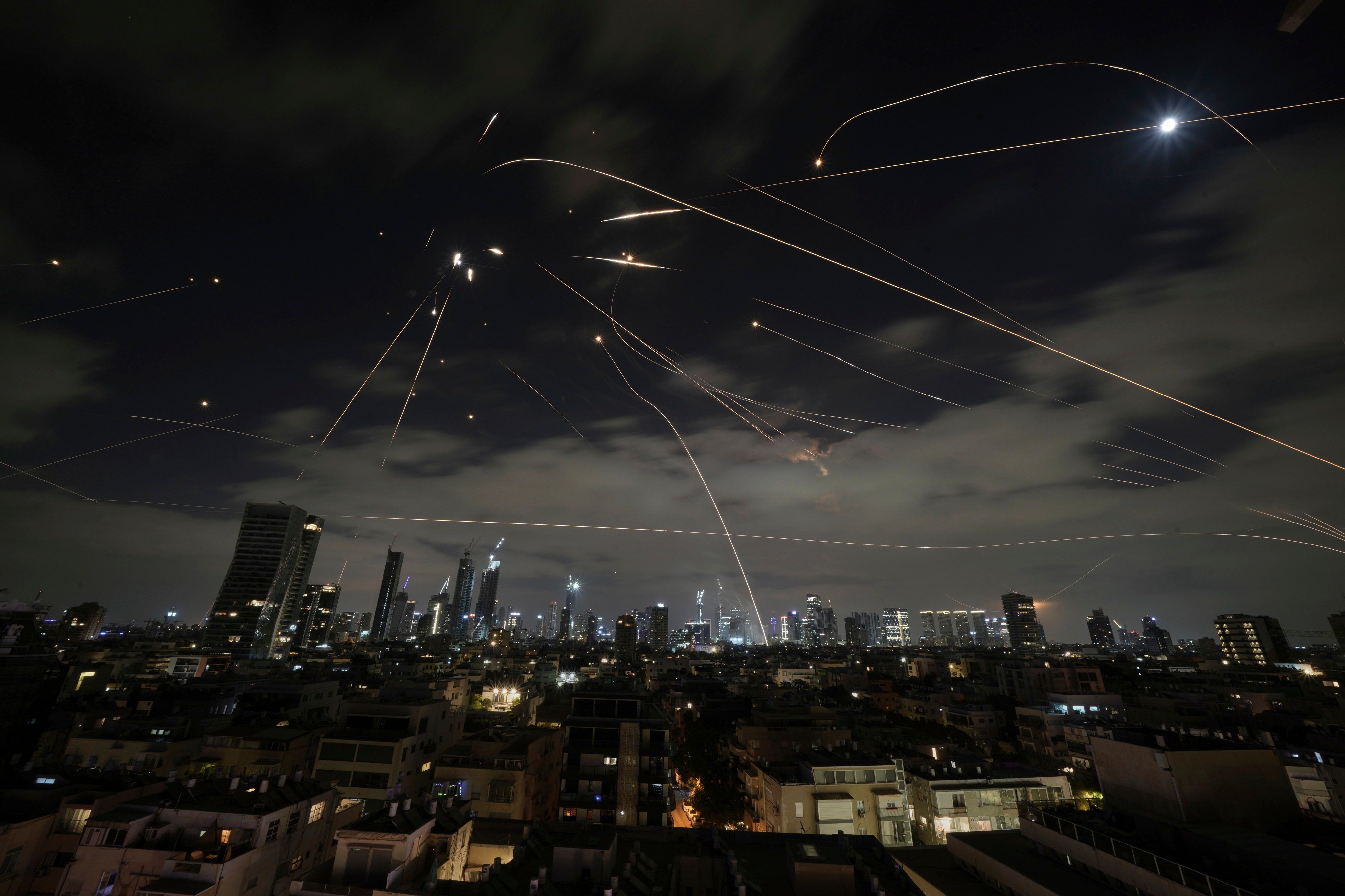 The Israeli Iron Dome air defence system fires to intercept missiles over Tel Aviv on Sunday. Photo: AP