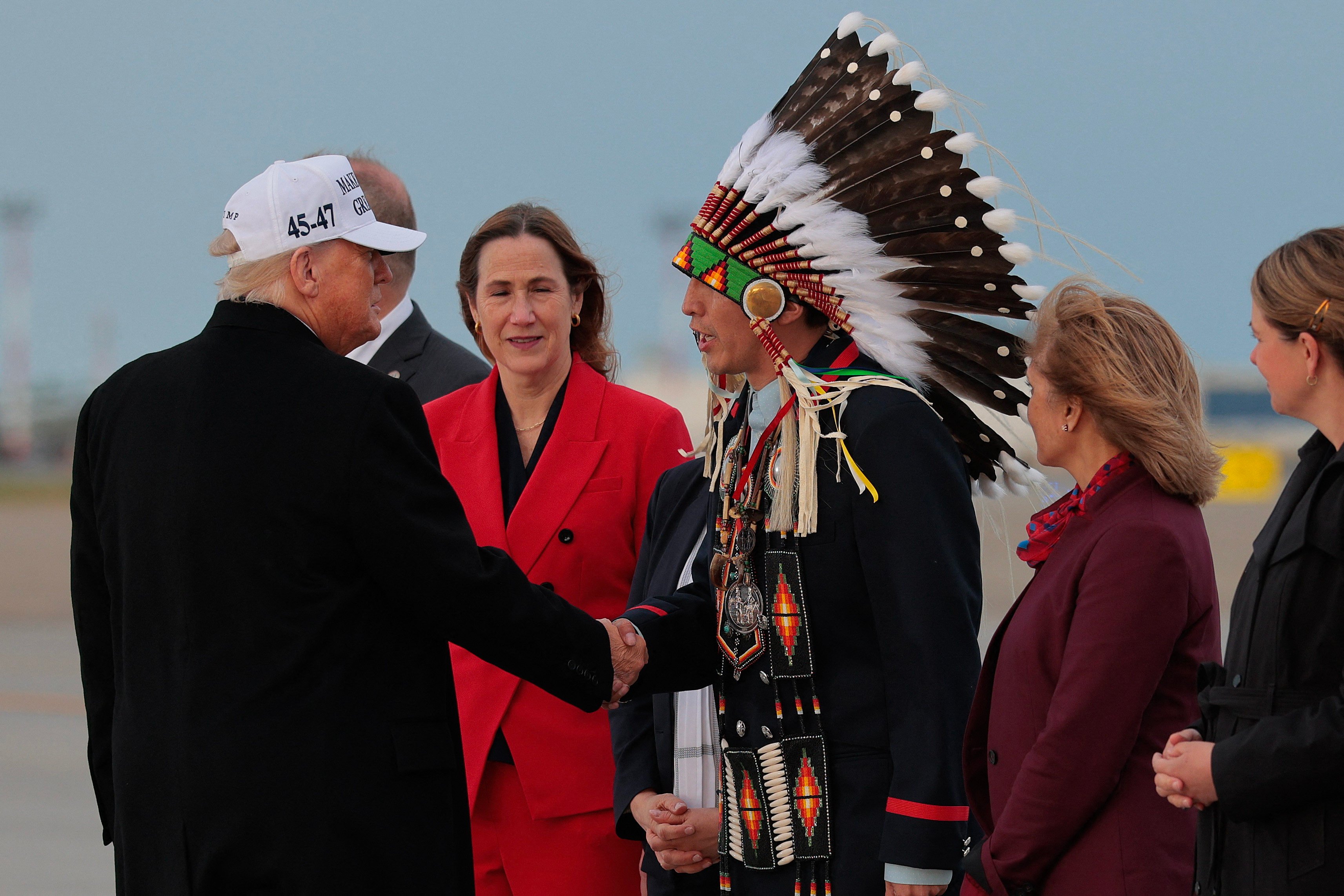 US President Donald Trump is greeted by Minor Chief Steven Crowchild of the Tsuut’ina nation on the sidelines of the G7 summit in Calgary, Canada on Sunday. Photo: Getty Images via AFP