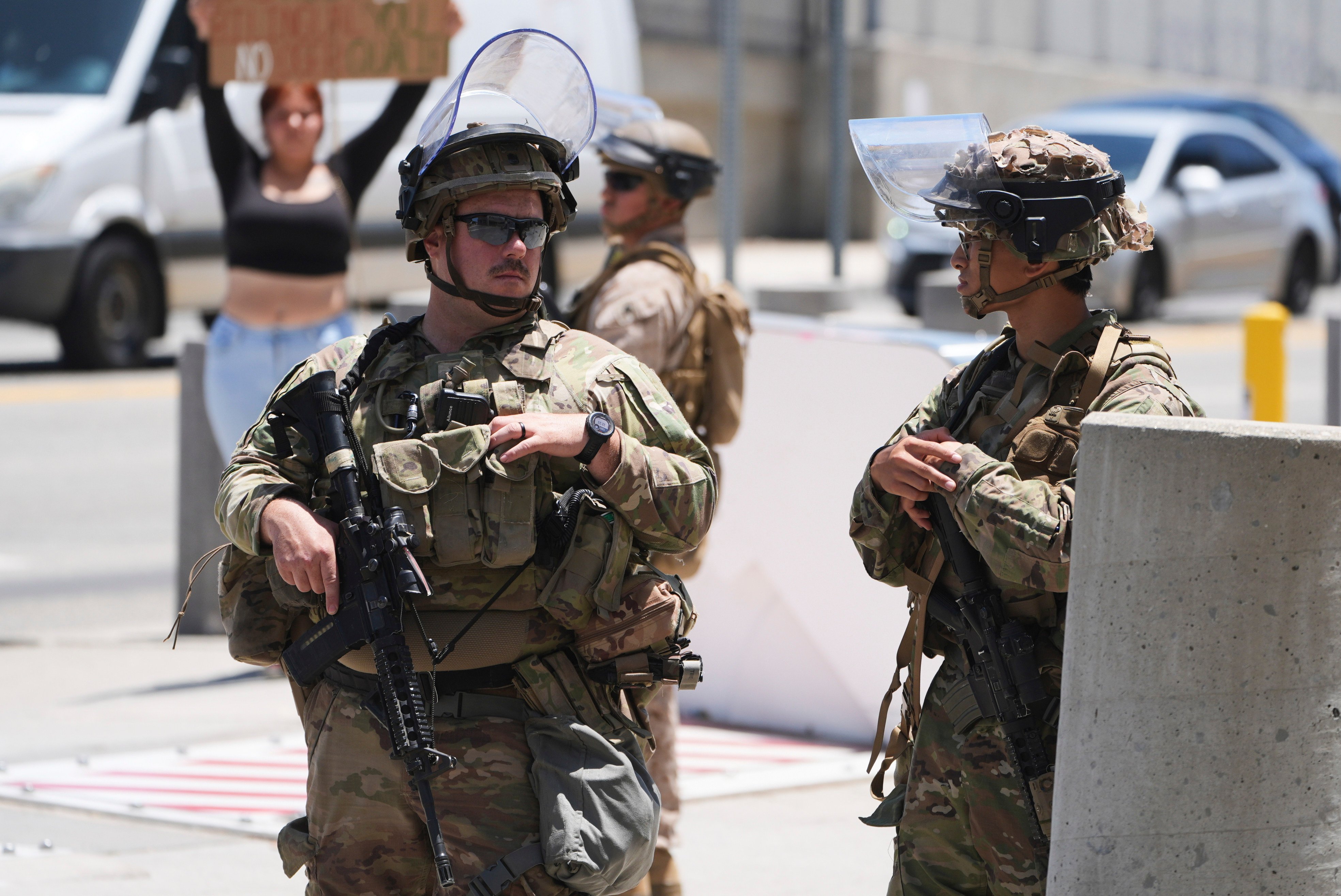 Members of the California National Guard and US Marines guard a federal building in Los Angeles on Tuesday. Photo: AP