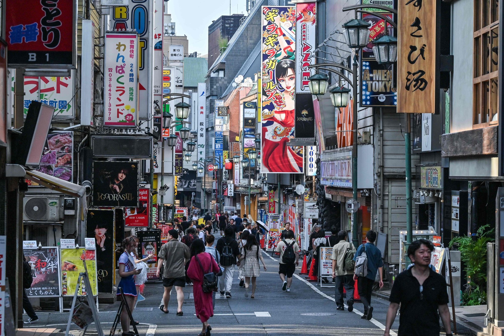 Pedestrians walk down a street in Shinjuku in central Tokyo. Dedicated non-alcohol bars are flourishing in Tokyo – and increasingly in Kyoto and Osaka. Photo: AFP Pedestrians walk down a street in Shinjuku in central Tokyo. Dedicated non-alcohol bars are flourishing in Tokyo – and increasingly in Kyoto and Osaka. Photo: AFP