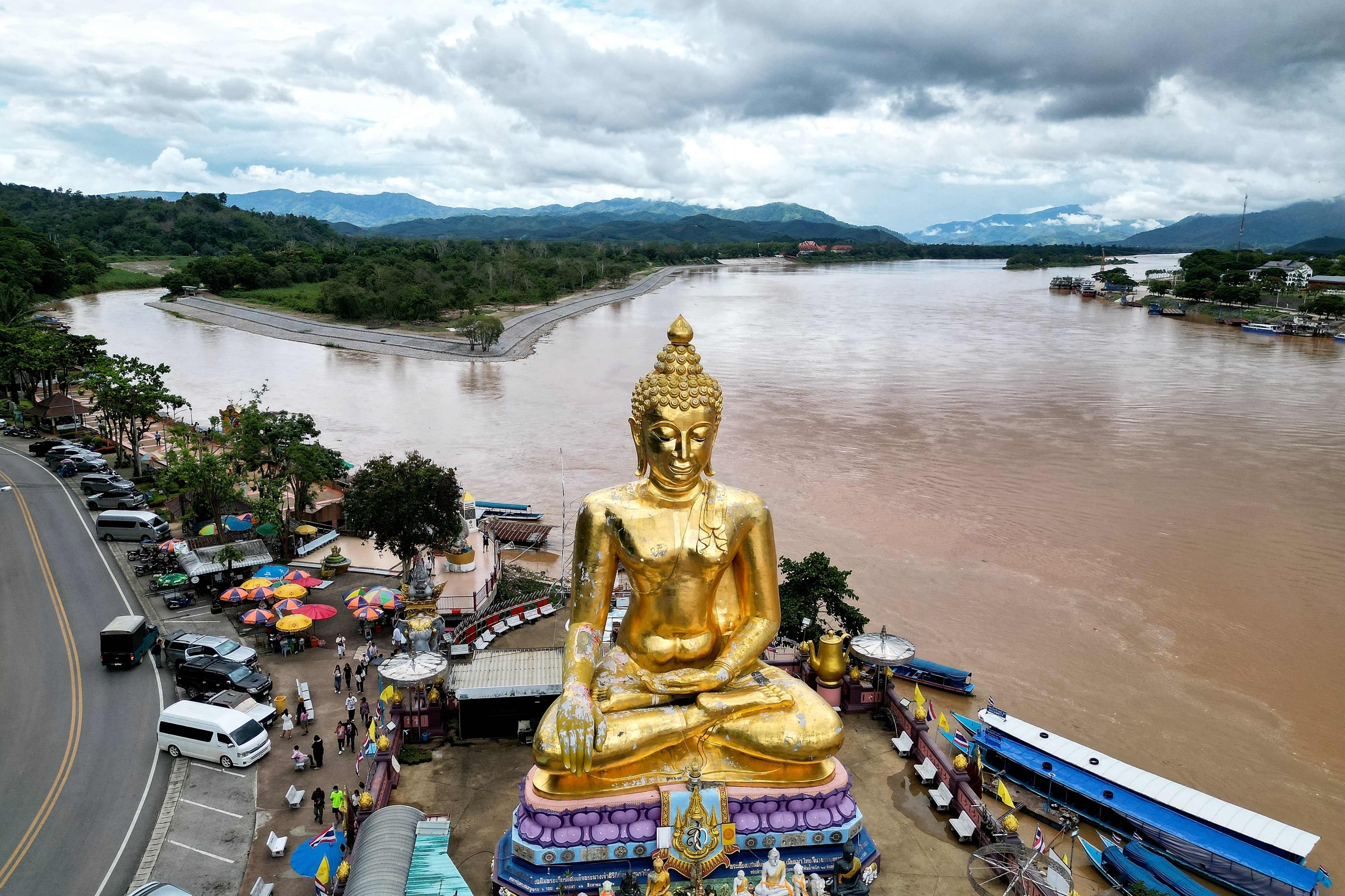 A giant Buddha statue in northern Thailand’s Chiang Rai province, with Thailand on the left and Myanmar in the centre,  A  new mine in northeast Myanmar is being blamed for rising pollution levels downstream in Thailand. Photo: AFP