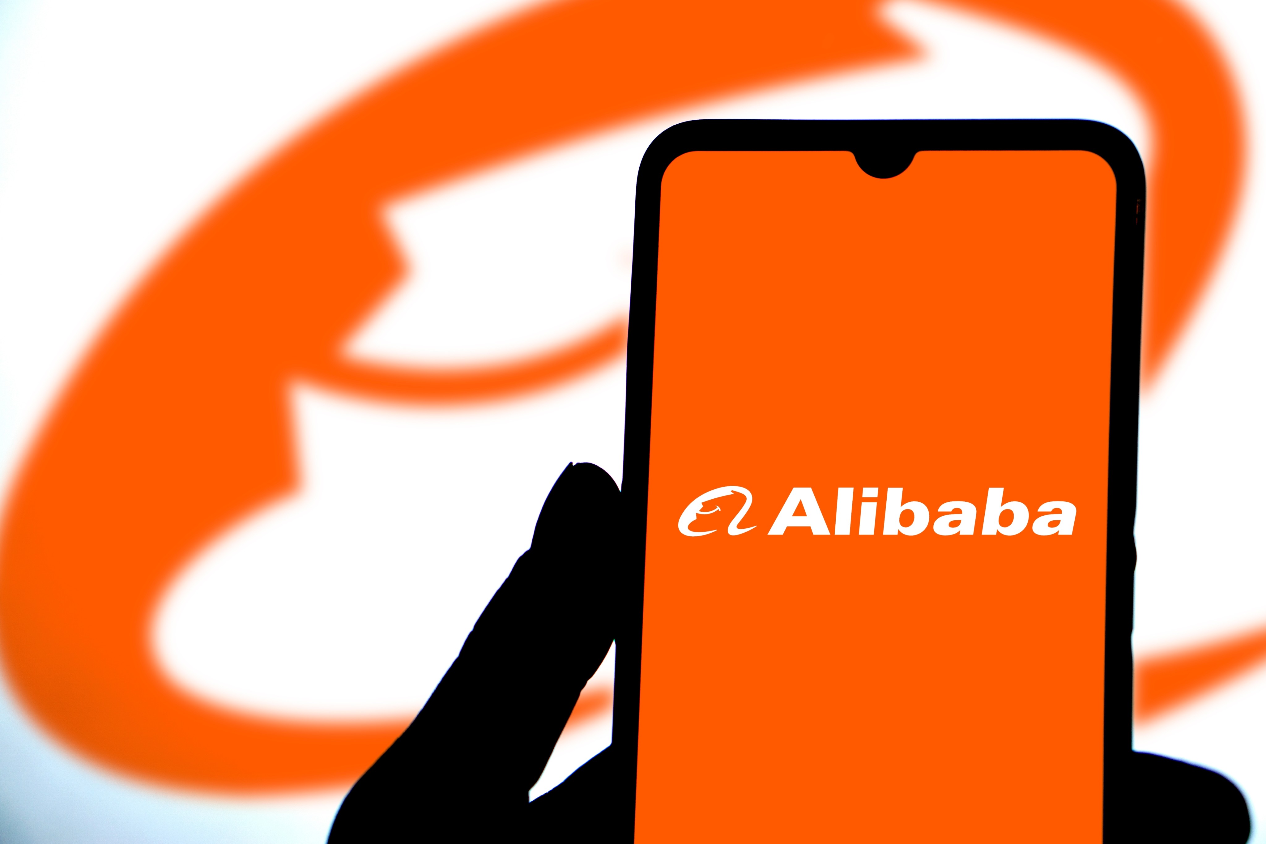 The Alibaba logo displayed on a smartphone. Photo: Shutterstock Images