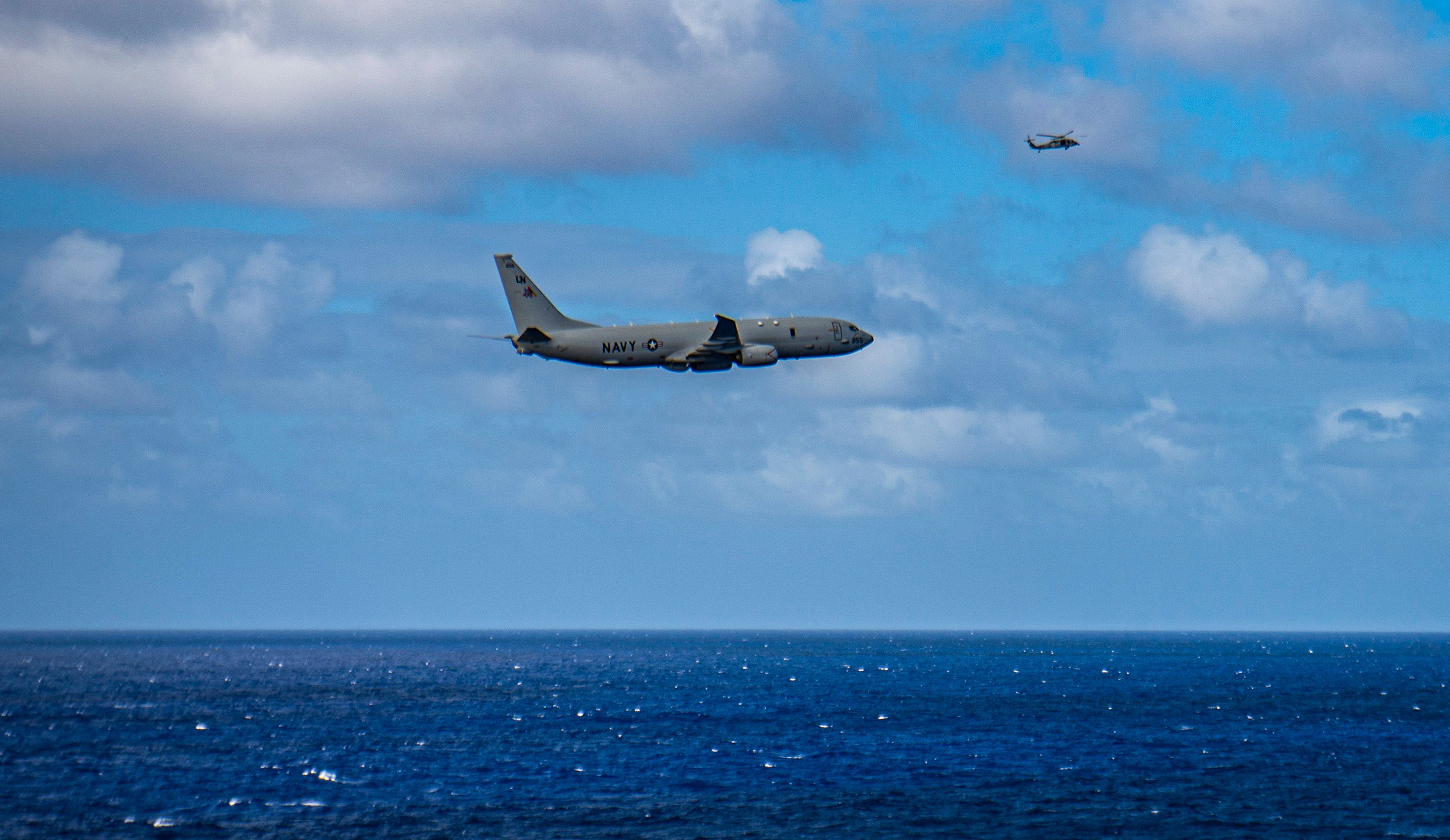 A P-8 Poseidon maritime patrol aircraft flies over the South China Sea. Photo: US Navy handout