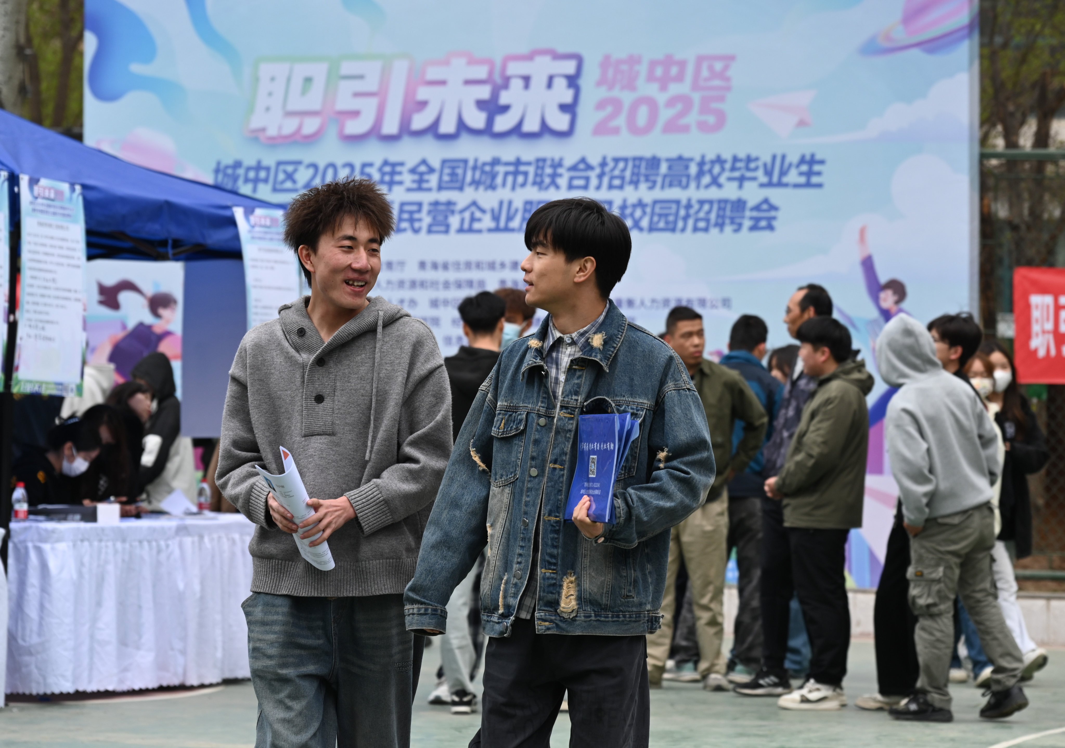 Students attend a campus job fair at a university in northwestern China’s Qinghai province. China’s youth unemployment rate remains stubbornly high ahead of a bumper graduation season this summer. Photo: Xinhua