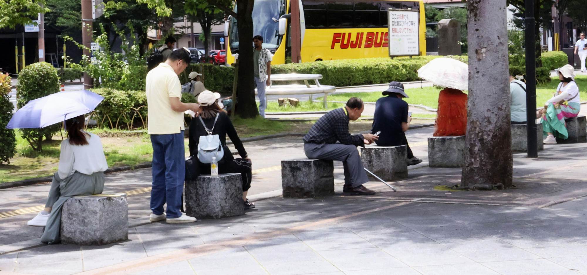 People rest in the shade in Kagoshima on Tuesday, as the scorching sun hits the southwestern Japan city with the mercury topping 33 degrees. Photo: Kyodo People rest in the shade in Kagoshima on Tuesday, as the scorching sun hits the southwestern Japan city with the mercury topping 33 degrees. Photo: Kyodo