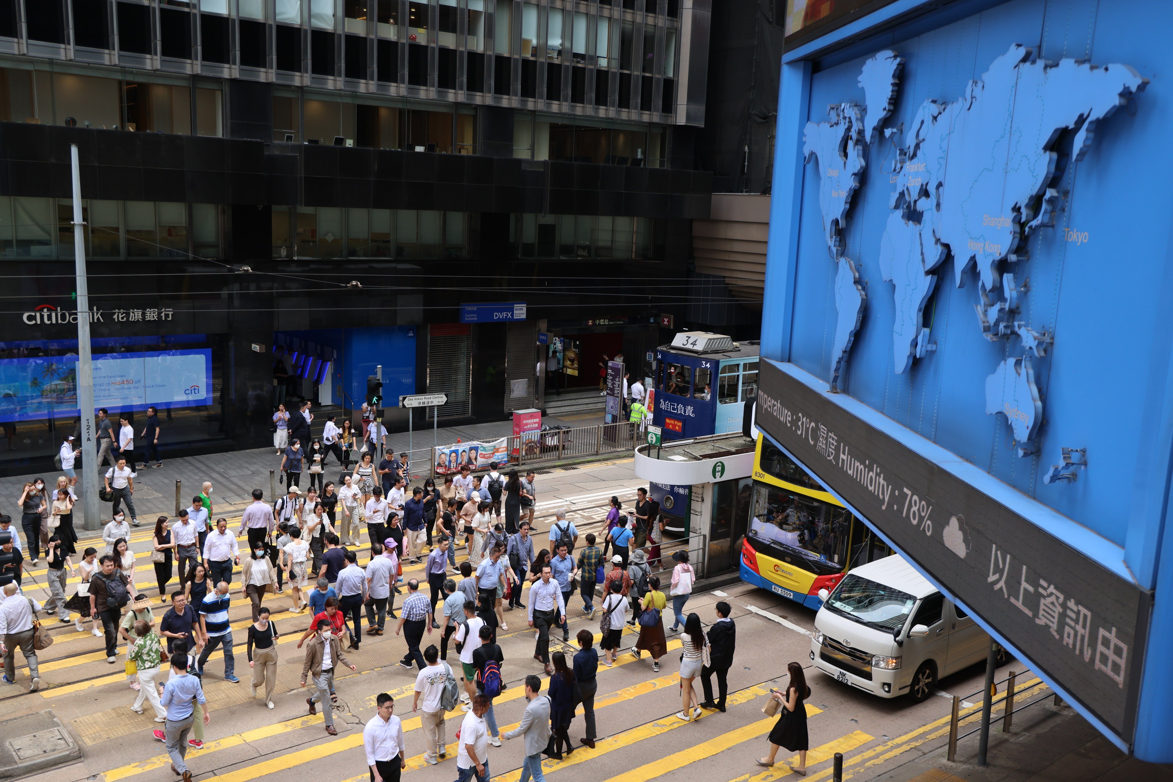 People cross a street in Central. Photo: Jelly Tse