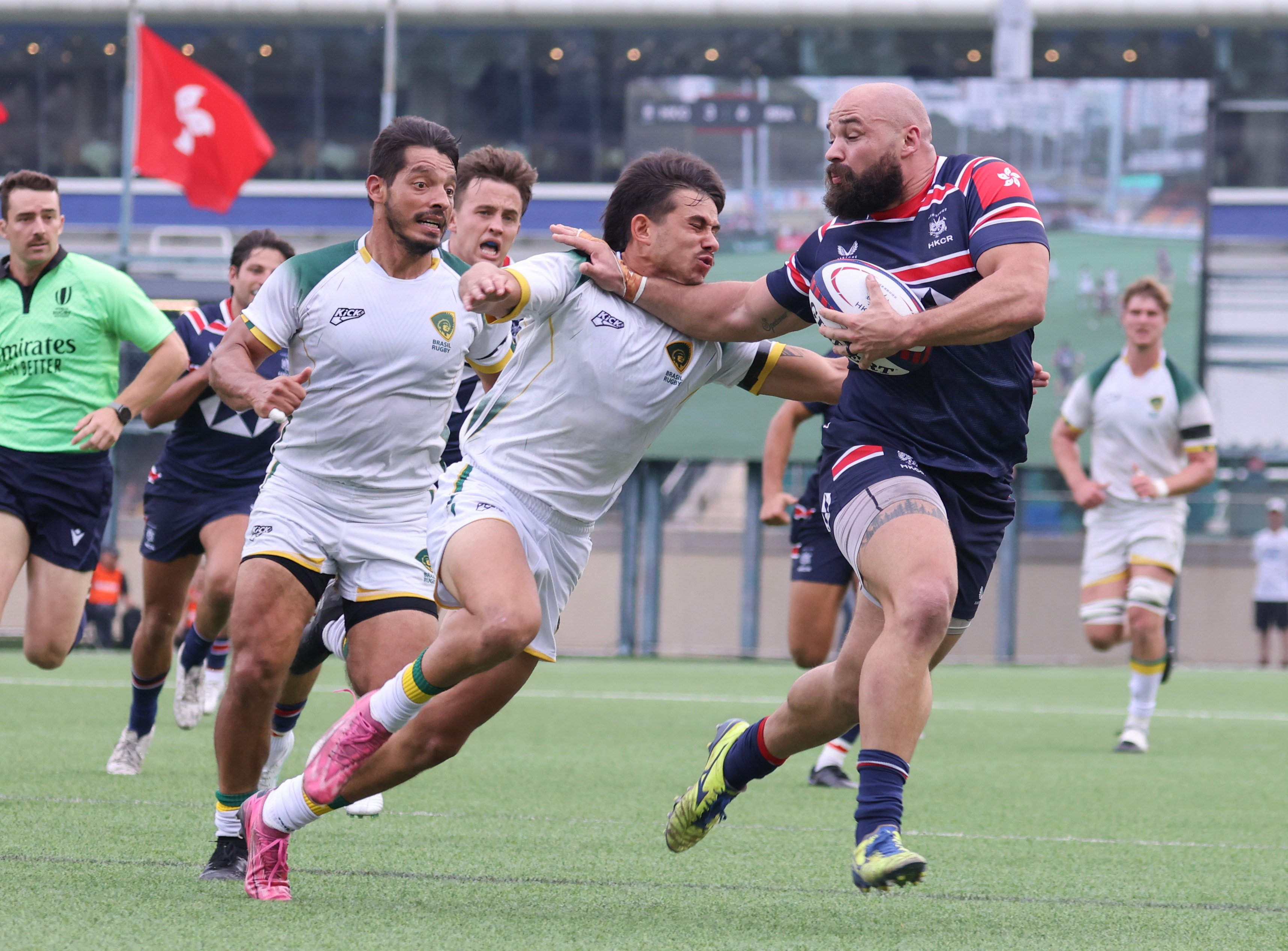 Luke van der Smit (right), pictured fending off a Brazilian tackler last November, will start for Hong Kong on Sunday. Photo: Nora Tam