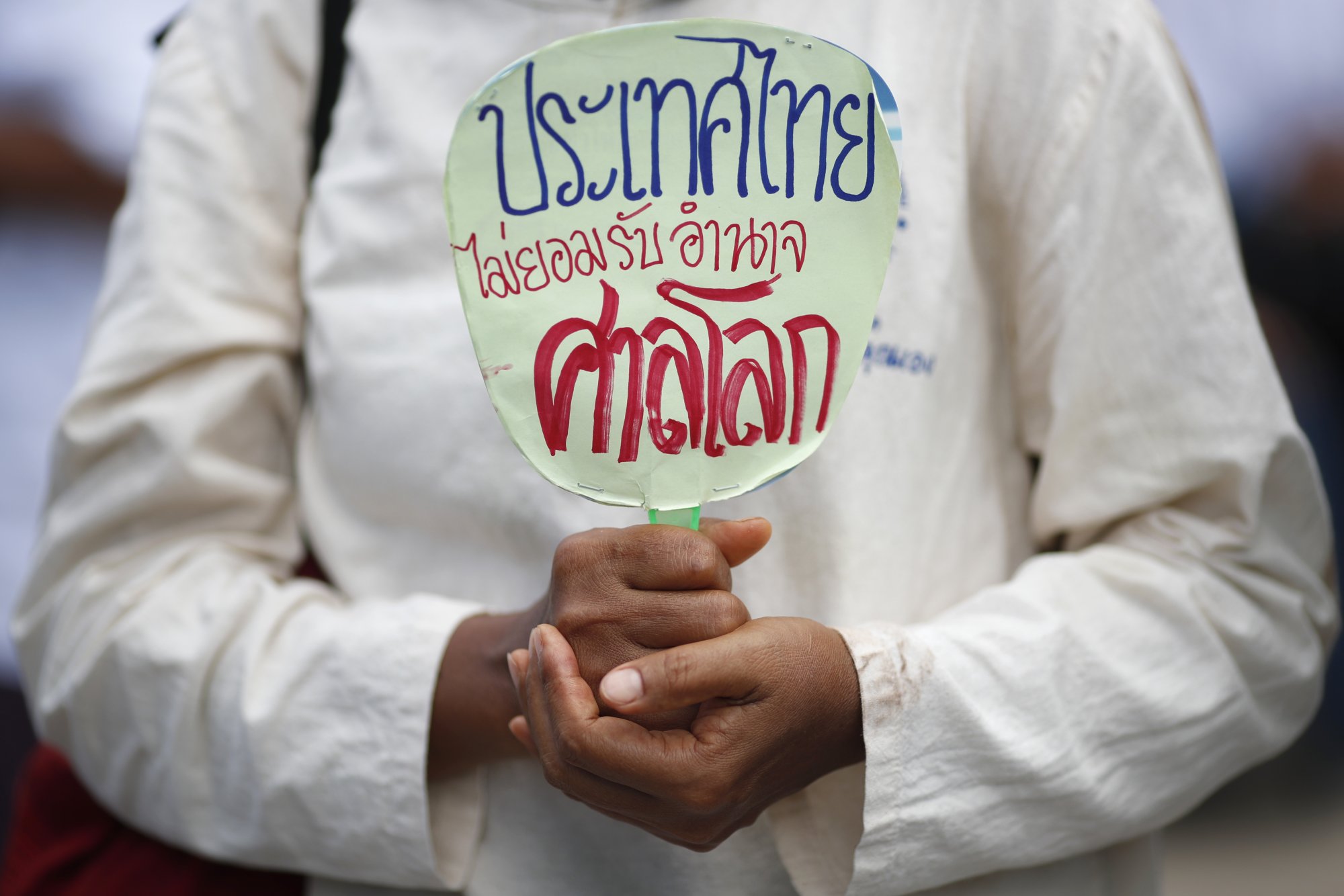 A Thai nationalist demonstrator holds a banner in Thai, translated as “Thailand does not recognise the jurisdiction of the International Court of Justice”, during a protest in Bangkok on June 9. Photo: EPA-EFE A Thai nationalist demonstrator holds a banner in Thai, translated as “Thailand does not recognise the jurisdiction of the International Court of Justice”, during a protest in Bangkok on June 9. Photo: EPA-EFE
