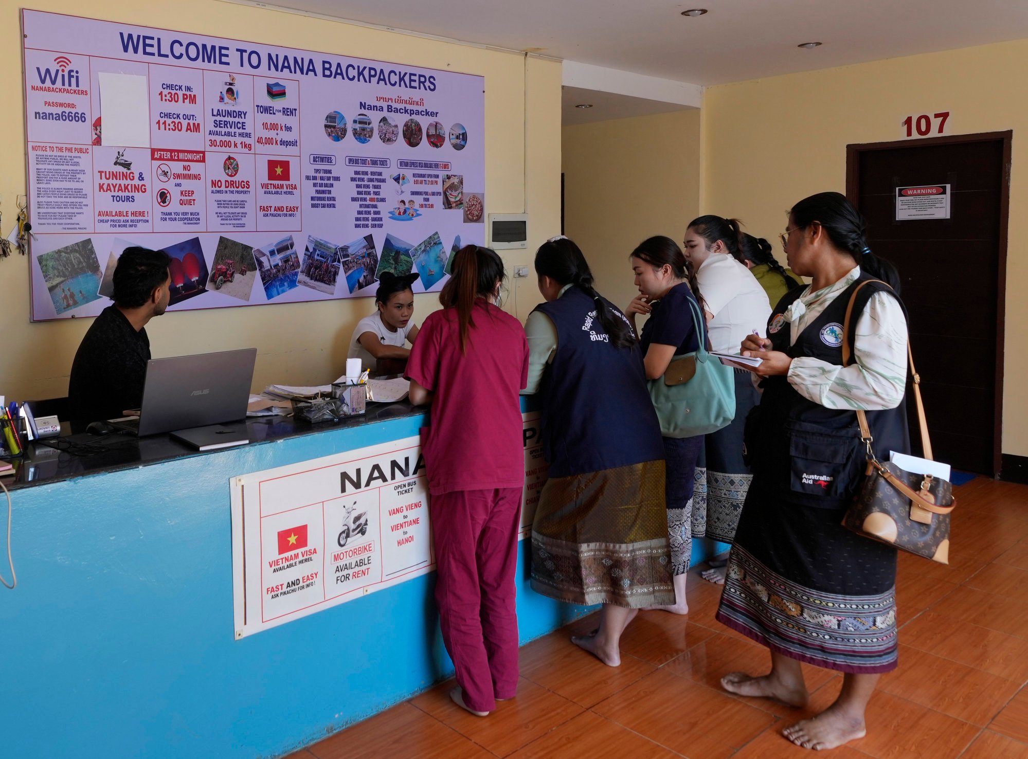 Health officials questioning Nana Backpackers Hostel employees in Vang Vieng, Laos, on November 22, last year. Photo: AP Health officials questioning Nana Backpackers Hostel employees in Vang Vieng, Laos, on November 22, last year. Photo: AP