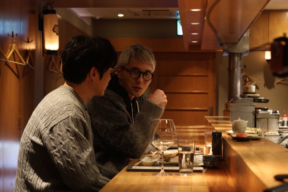 Netflix reality show “K-foodie meets J-foodie” follows South Korean YouTuber Sung Si-kyung and Japanese actor Yutaka Matsushige as they share meals in their respective countries.  Photo:  Netflix