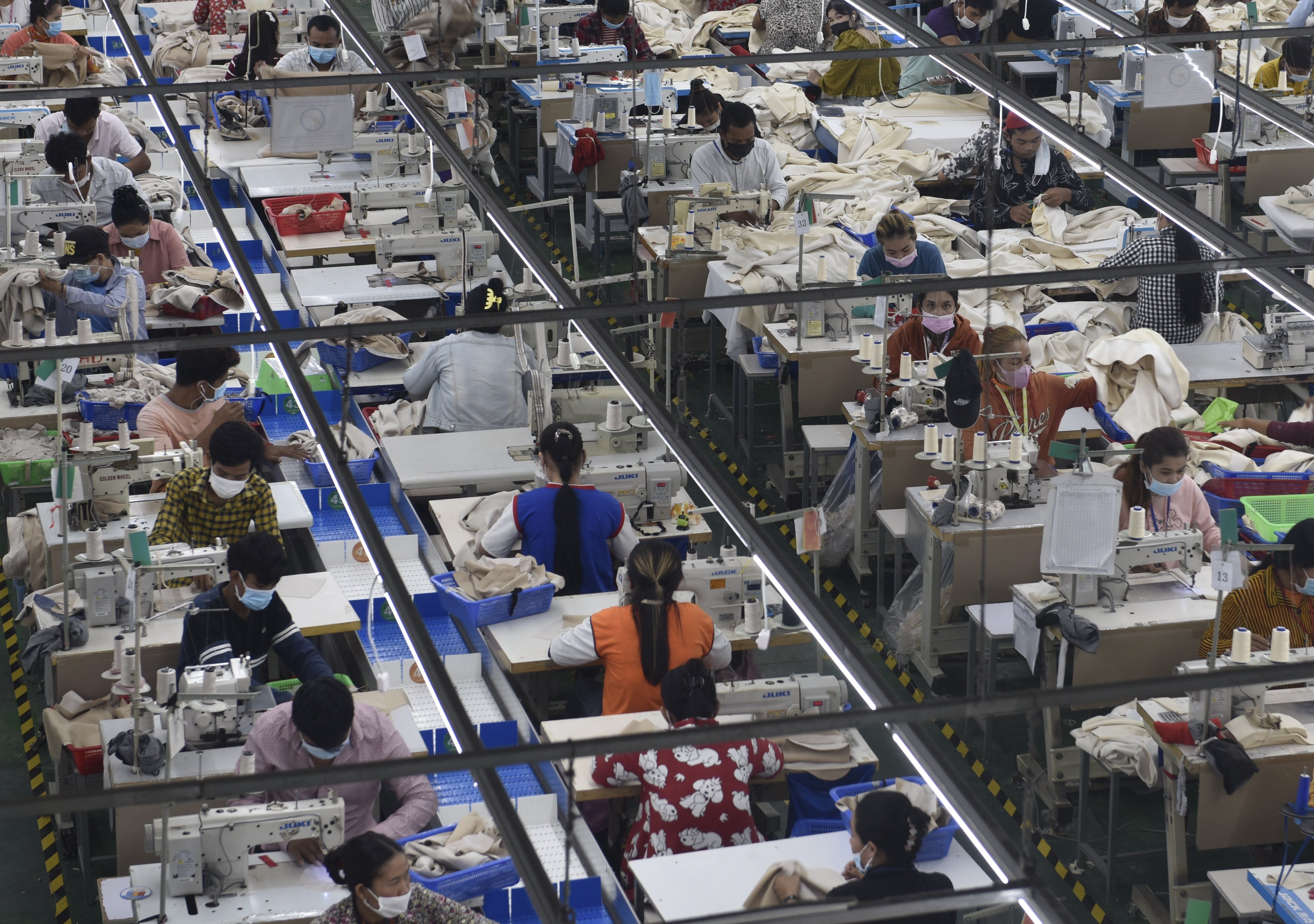 Garment workers make clothes at a factory in Phnom Penh, Cambodia, on December 17, 2021. Photo: Xinhua