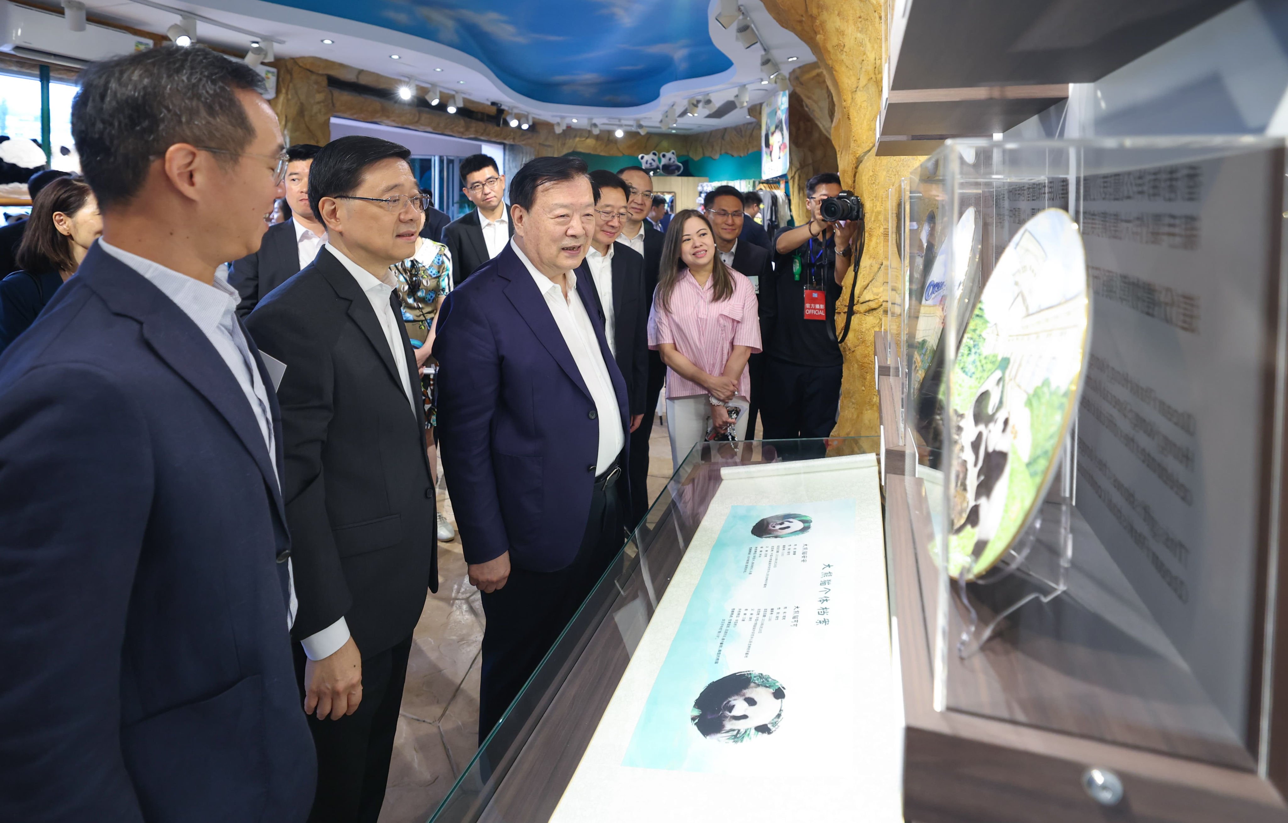 Xia Baolong (centre), with city leader John Lee and other officials, visits Ocean Park’s pandas on the third day of his trip. Photo: Handout