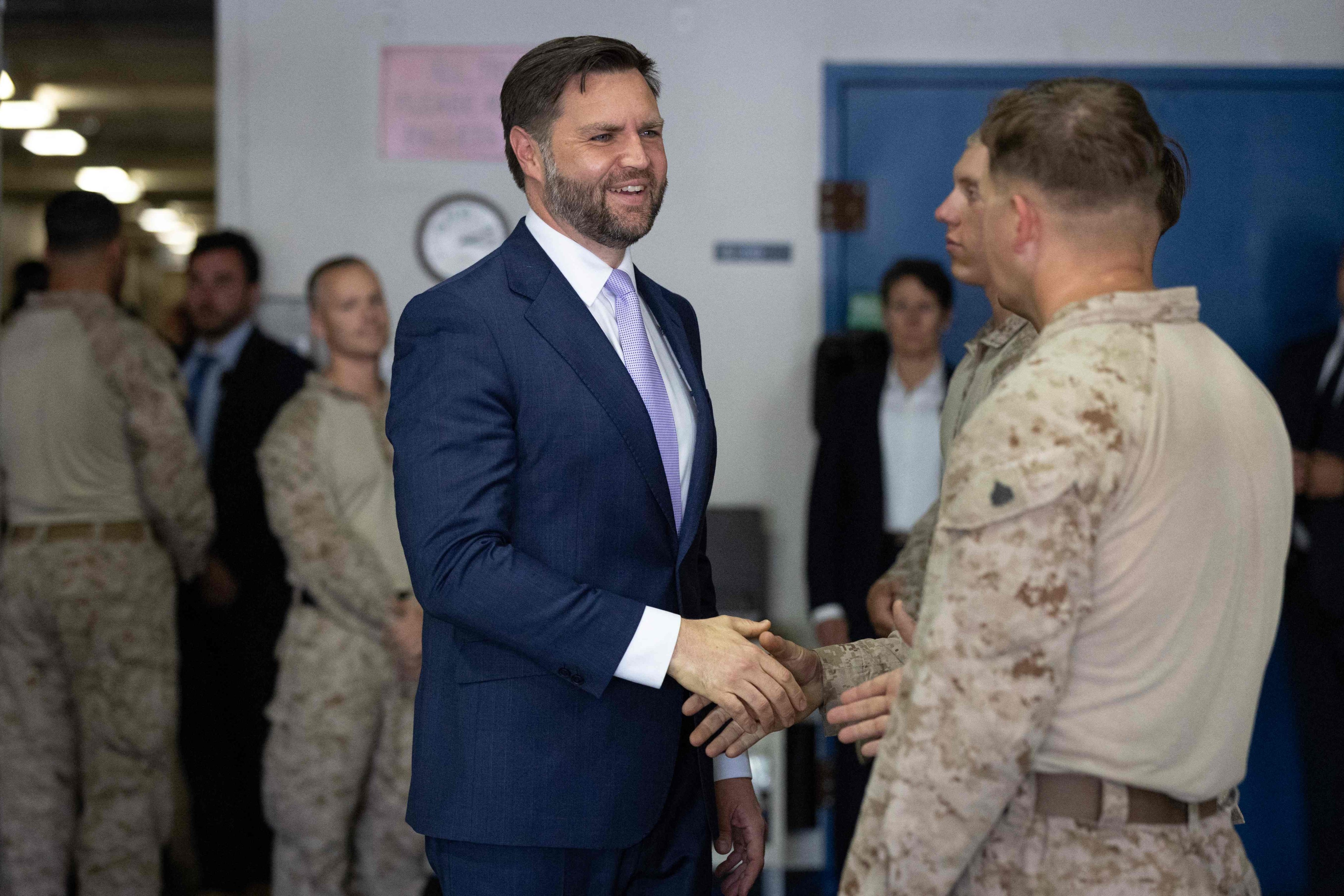 US Vice President J.D. Vance greets Marines following a tour of the multiagency Federal Joint Operations Centre at the Wilshire Federal Building in Los Angeles on Friday. Photo: Getty Images via AFP