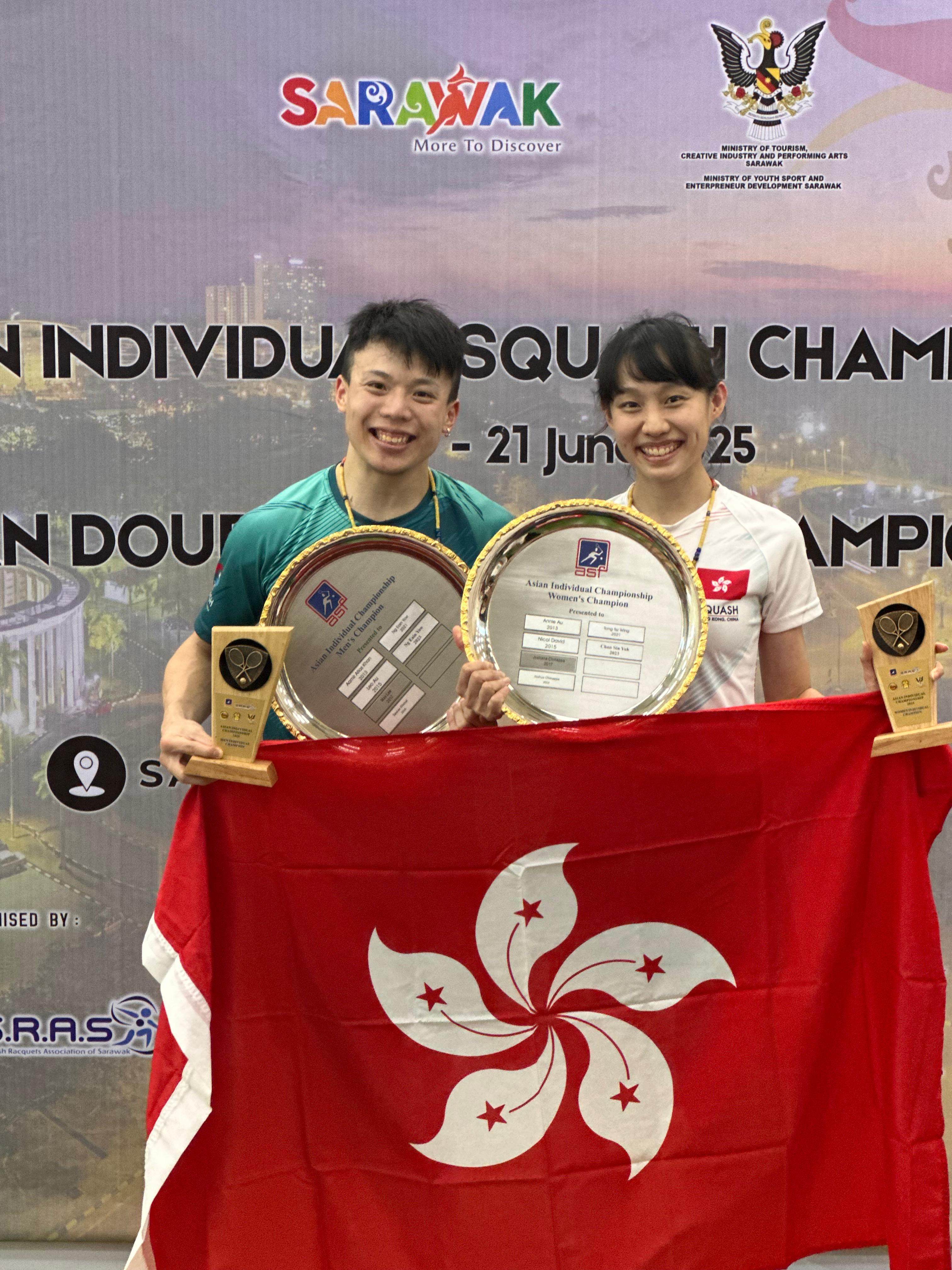 Alex Lau (left) and Tomato Ho are all smiles after triumphing in the men’s and women’s sections. Photo: Squash Association of Hong Kong, China
