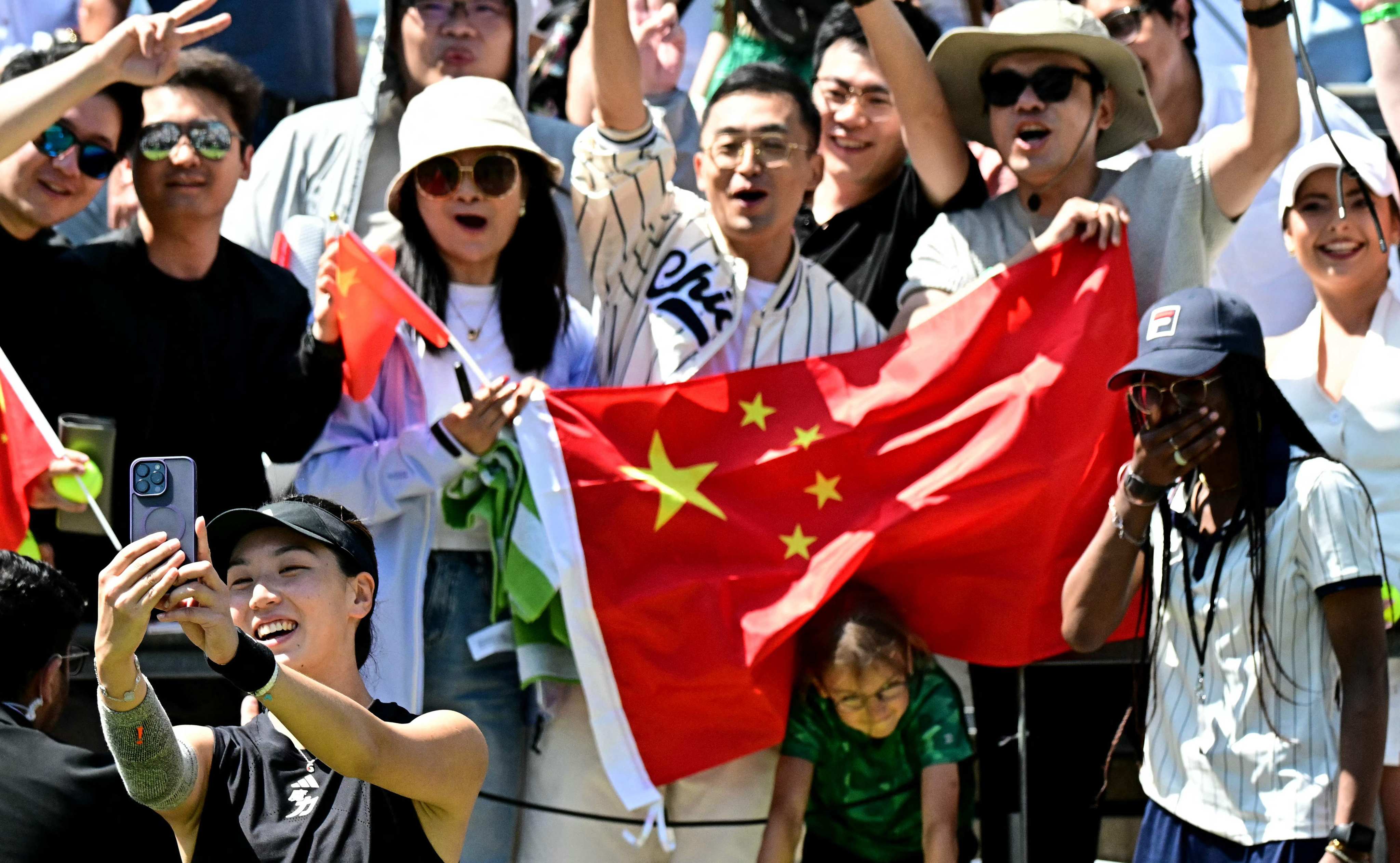 China’s Xinyu Wang  poses for a selfie with fans after victory over Spain’s Paula Badosa in their quarter-final matchup at the Berlin Open. Photo: AFP