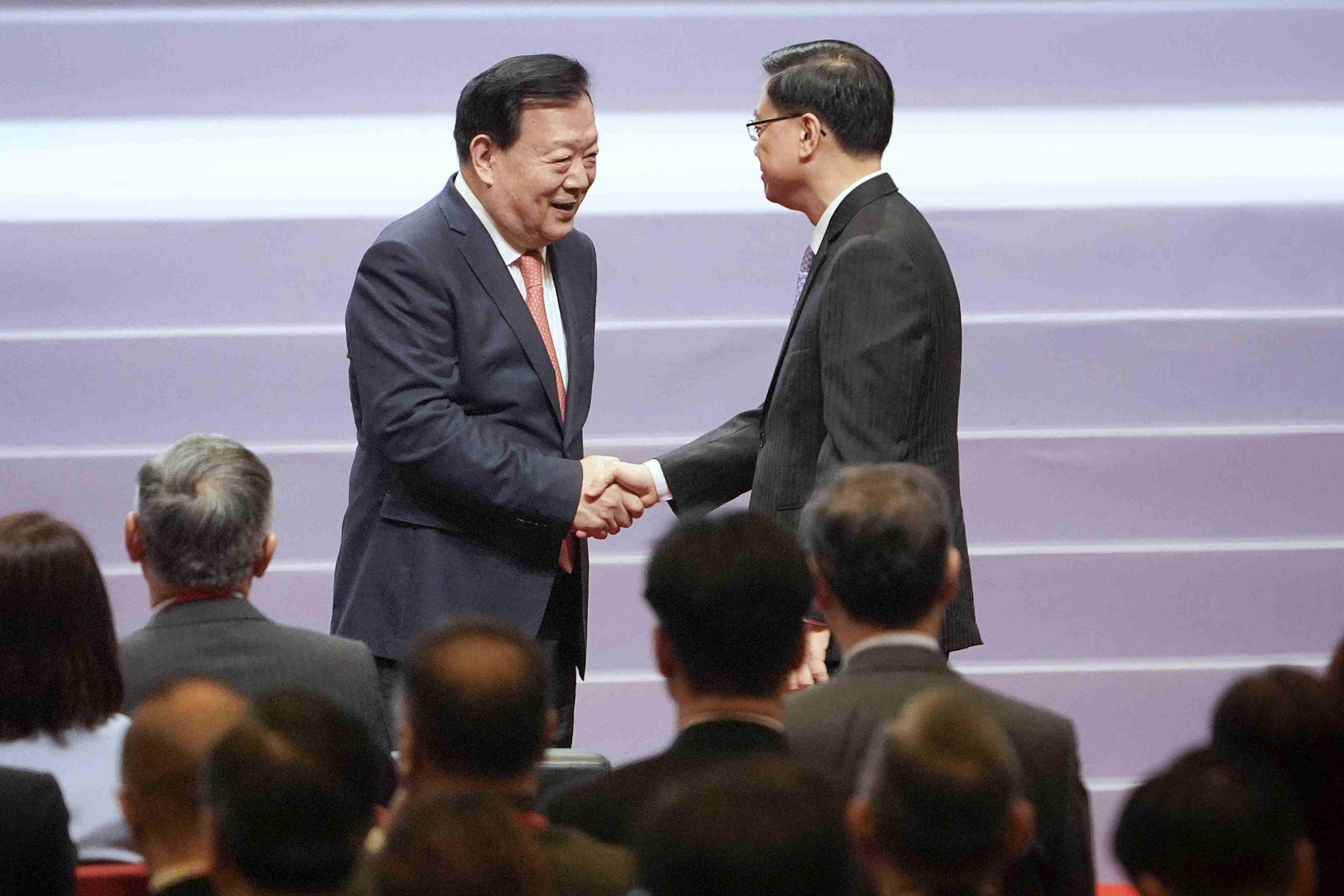Xia Baolong (left) with city leader John Lee.  Photo: Elson Li