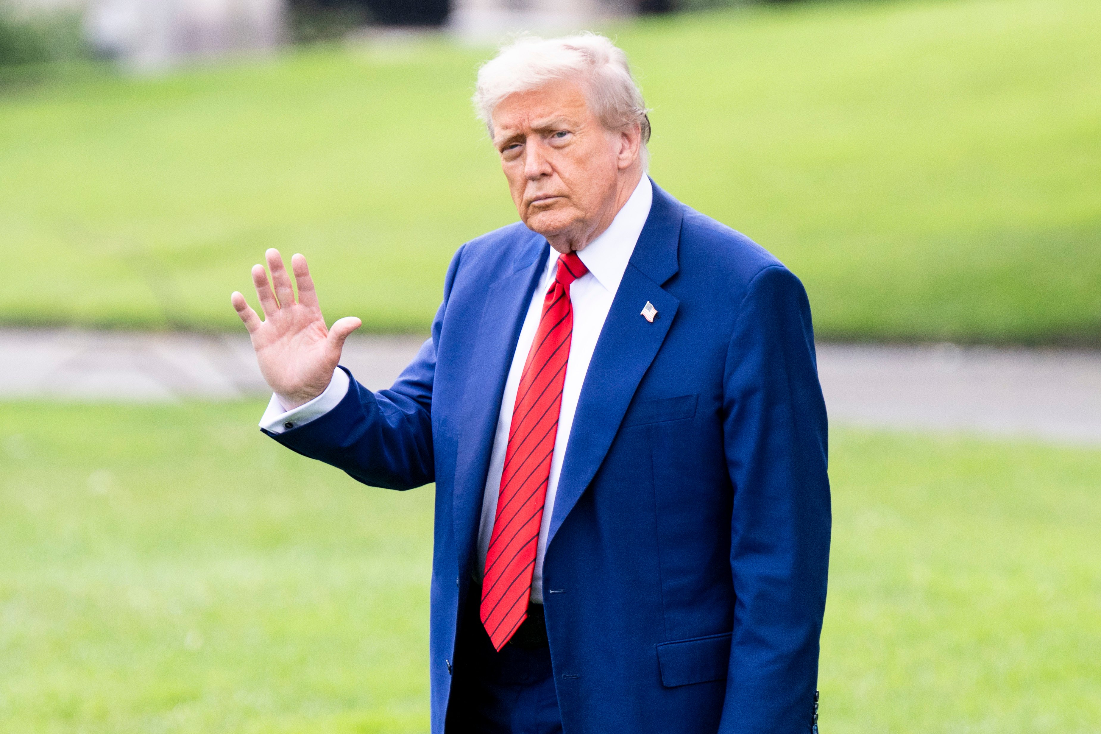 US President Donald Trump waves as he walks towards Marine One while departing the White House in Washington on Friday. Photo: ZUMA Press Wire/dpa