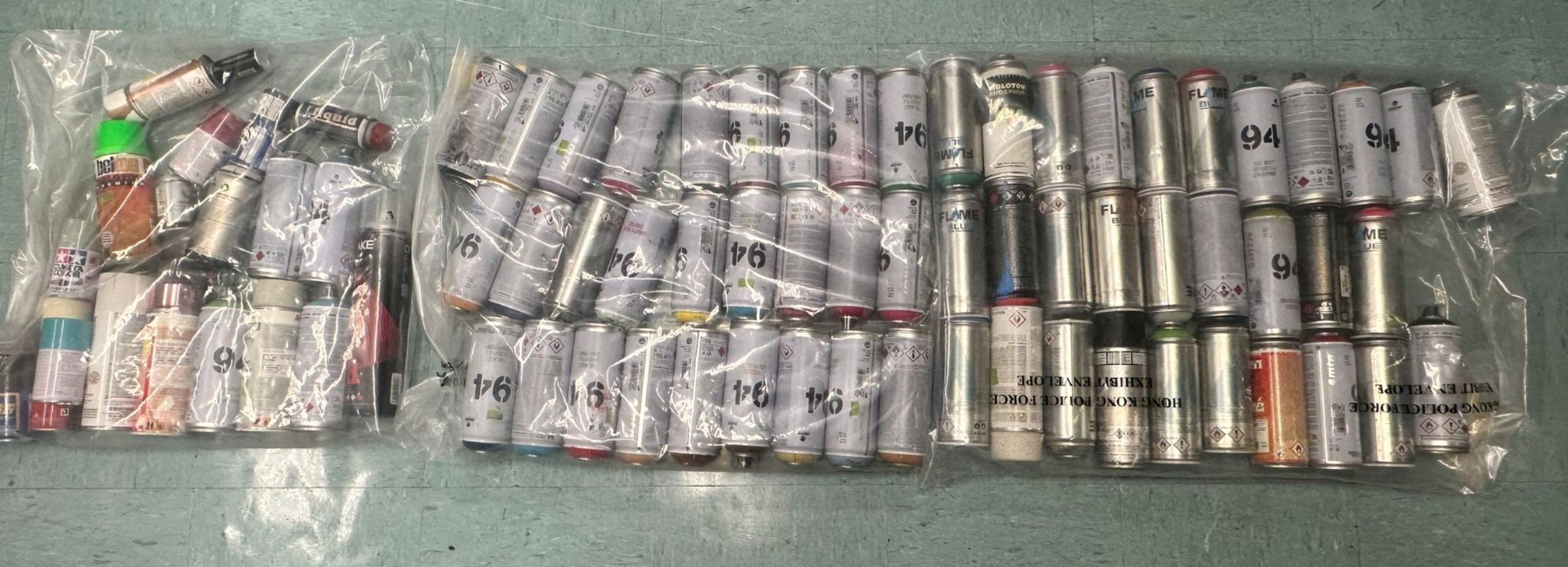 Police seized dozens of cans of spray paint during the arrest operation. Photo: Handout