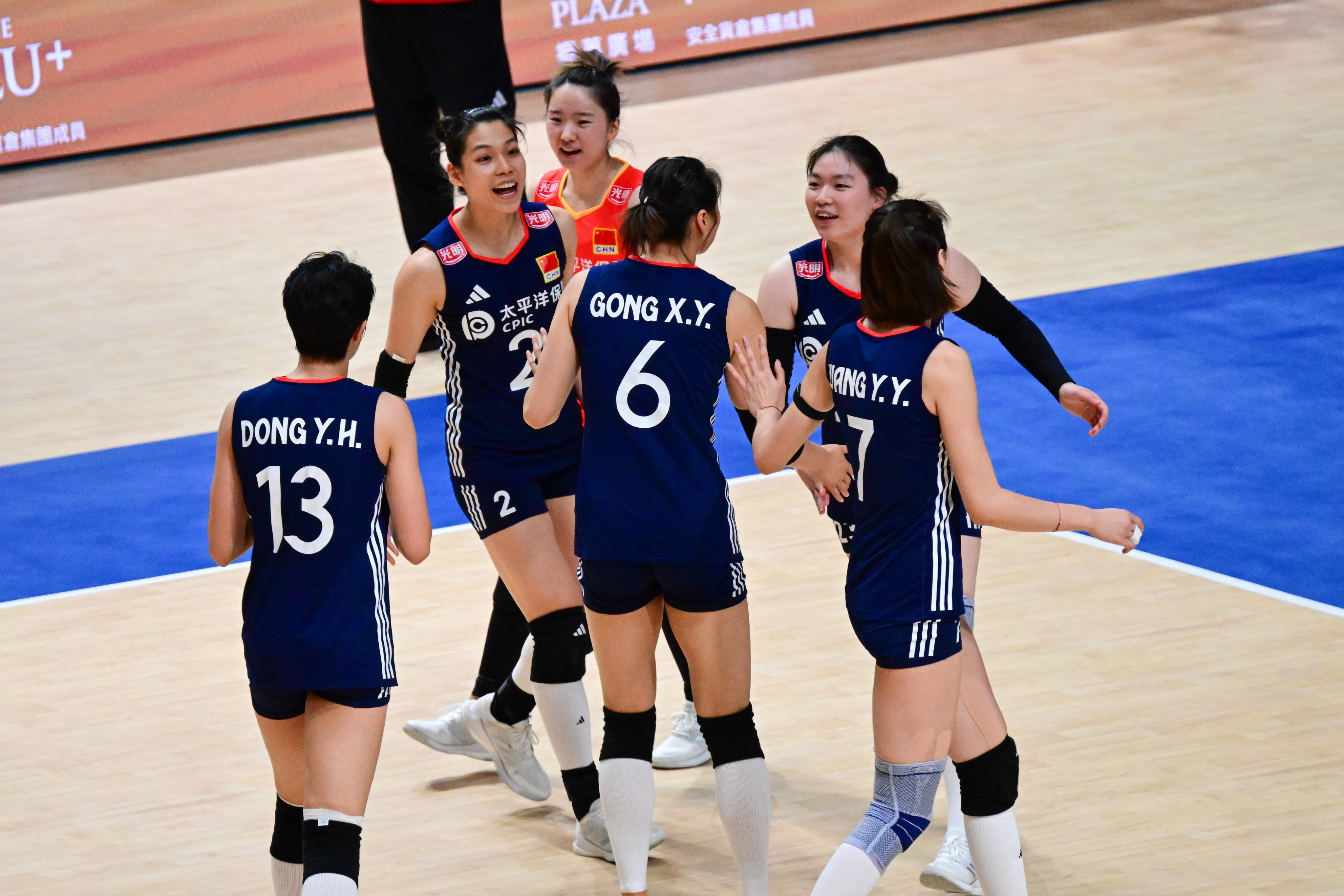 China players celebrate winning a point during their match against Italy at Kai Tak Arena. Photo: Xinhua