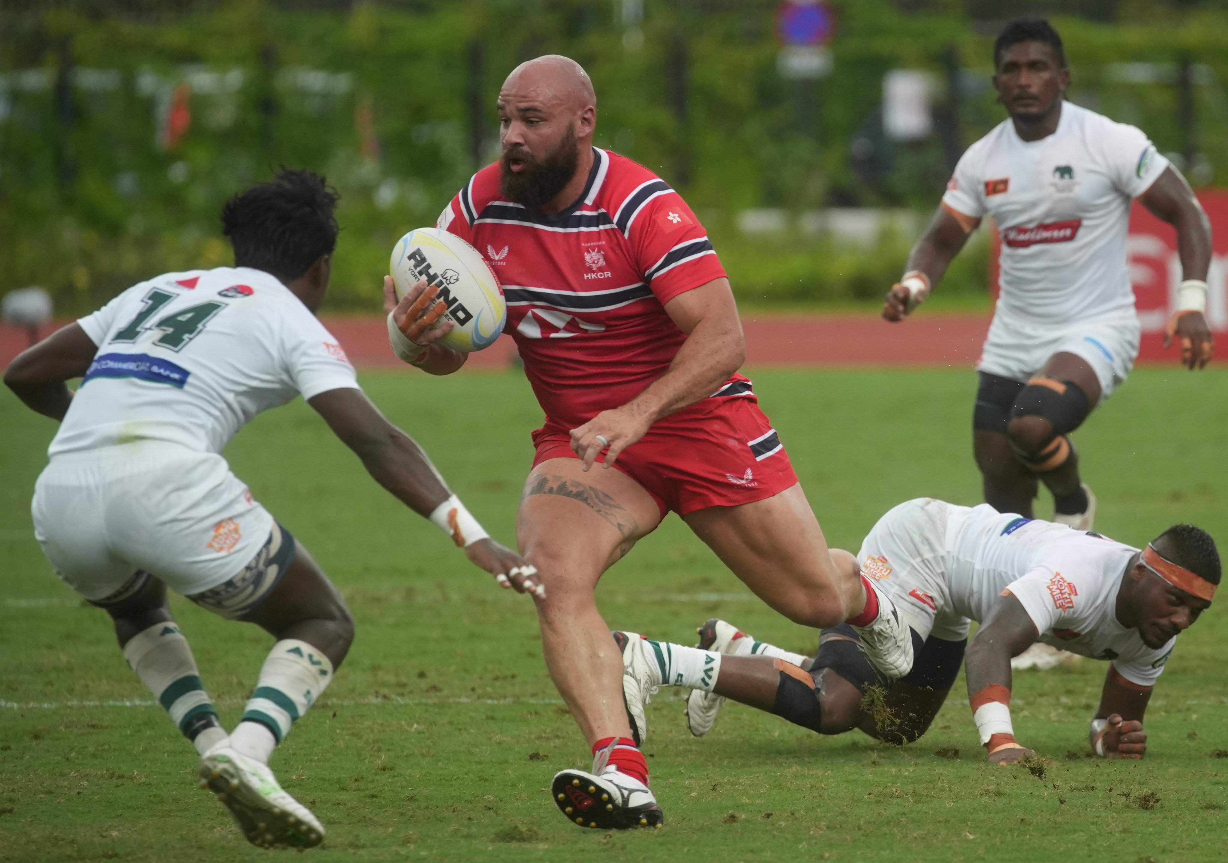 Man of the match Luke van der Smit on the charge for Hong Kong against Sri Lanka on Sunday. Photo: Sun Yeung