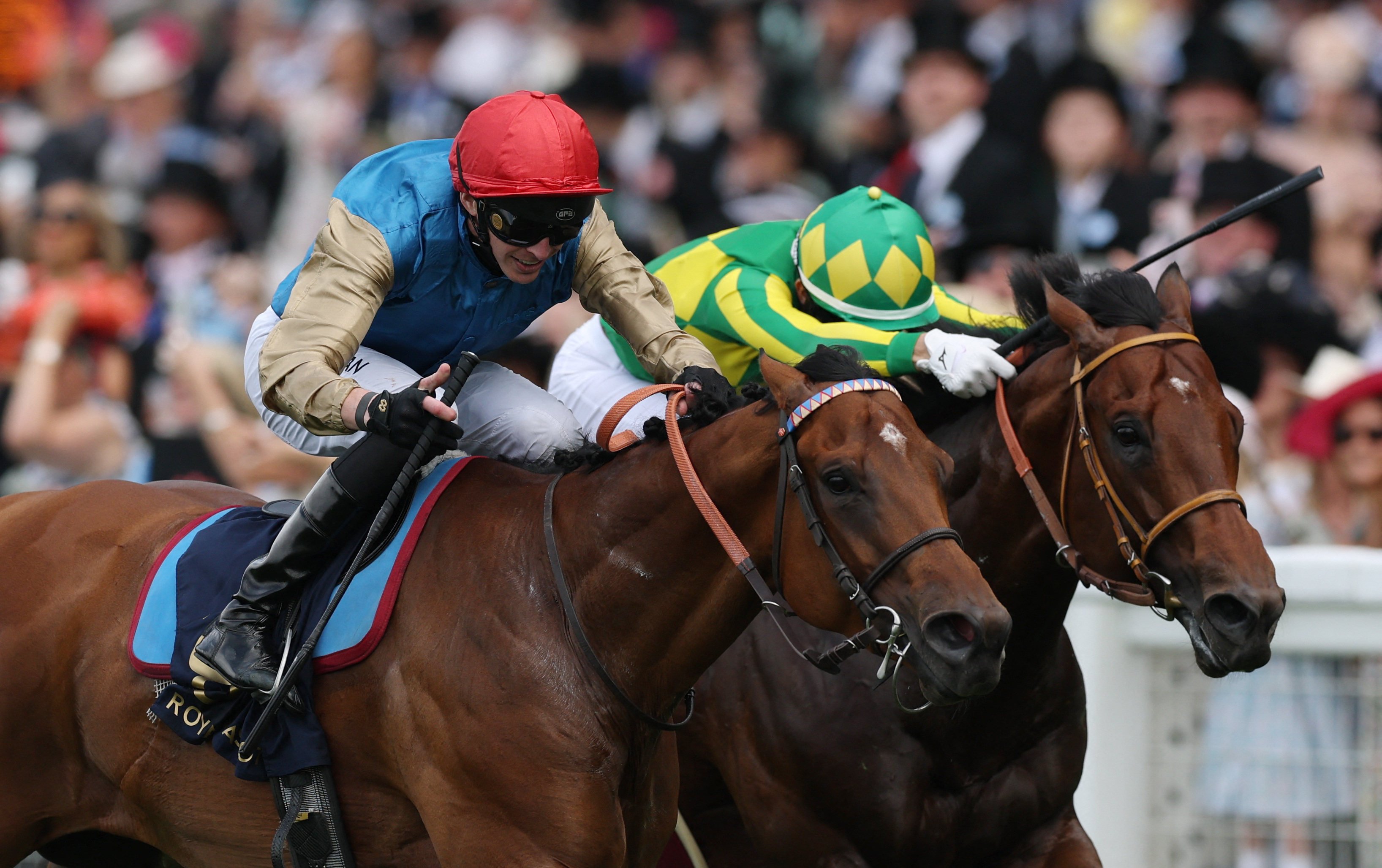 Lazzat (red cap) and James Doyle get the better of Satono Reve. Photo: Reuters