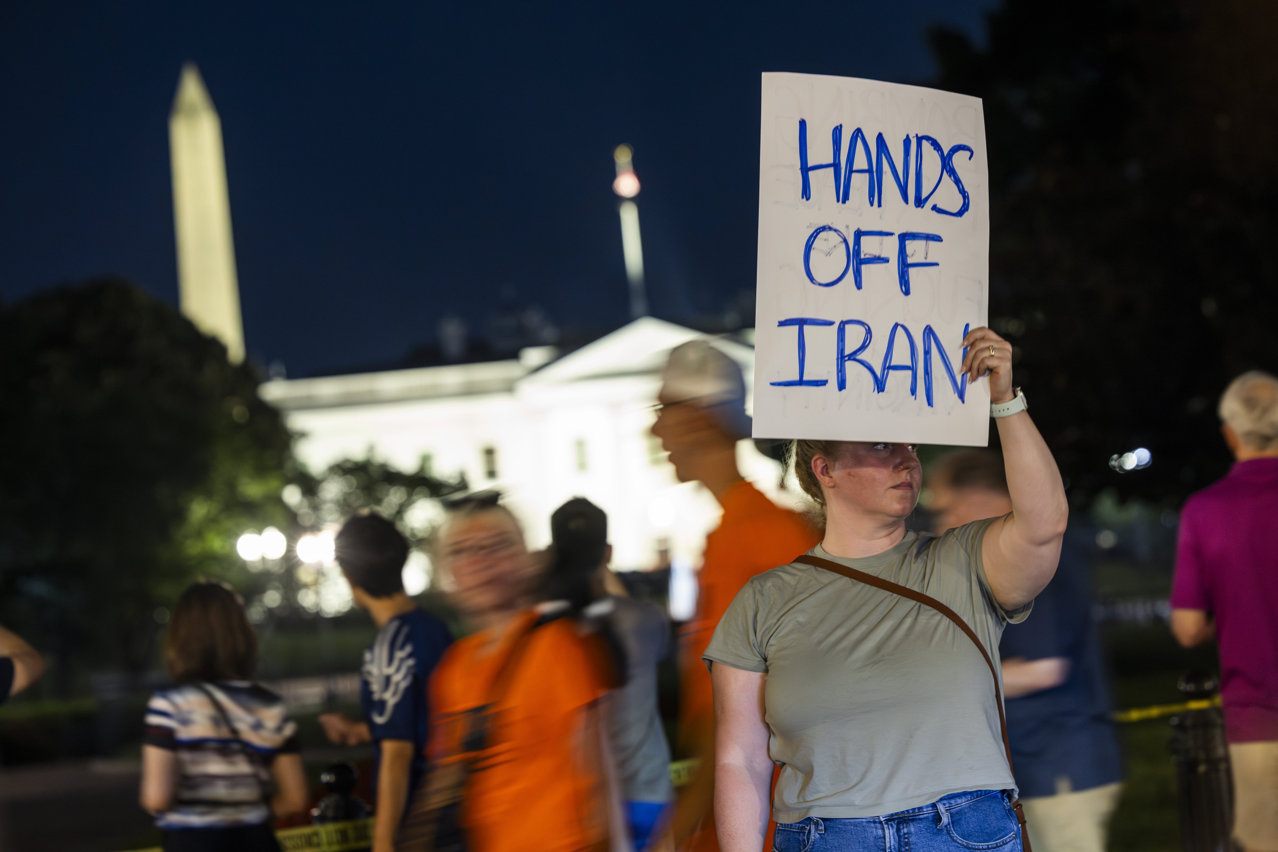 A protester stands outside the White House ahead of US President Donald Trump’s address to the nation. Photo: EPA-EFE