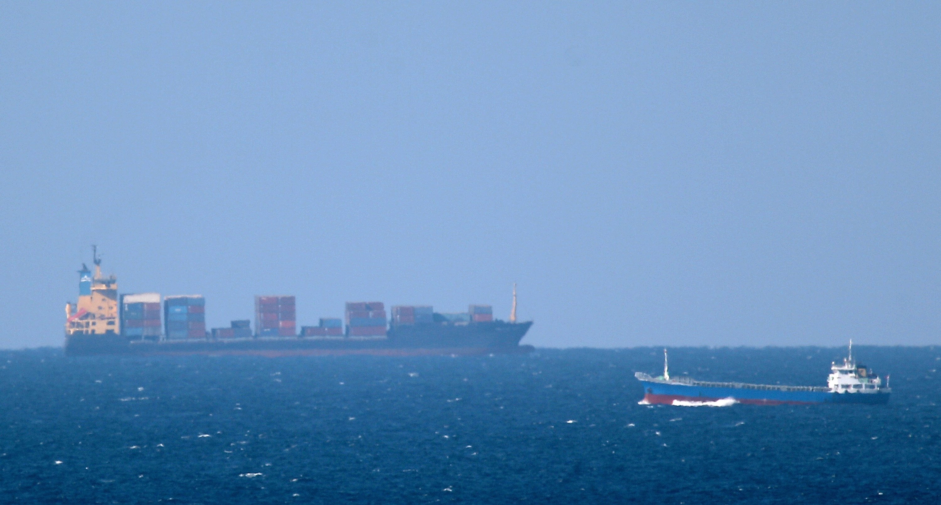 A cargo ship cruises towards the Strait of Hormuz off the shores of Khasab in Oman on January 15, 2012. Photo: AFP
