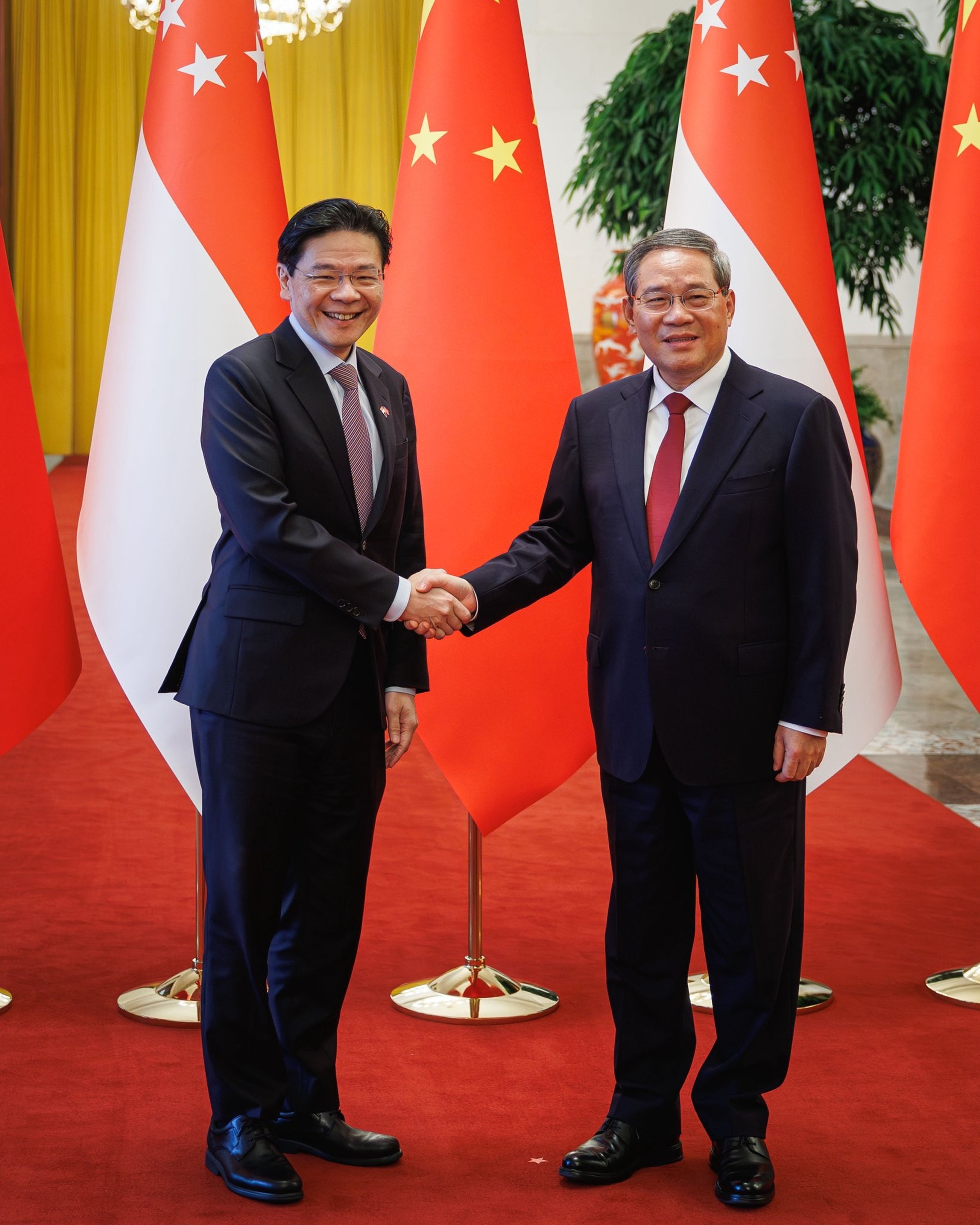 Singaporean Prime Minister Lawrence Wong (left) meets Chinese Premier Li Qiang in Beijing on Monday. Photo: Handout