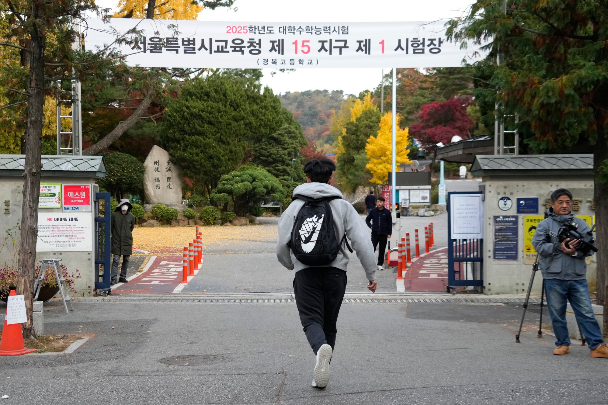 A student runs to take a university entrance exam in Seoul last year. The death of three teenage girls has sparked calls for education reforms in South Korea. Photo: AP A student runs to take a university entrance exam in Seoul last year. The death of three teenage girls has sparked calls for education reforms in South Korea. Photo: AP