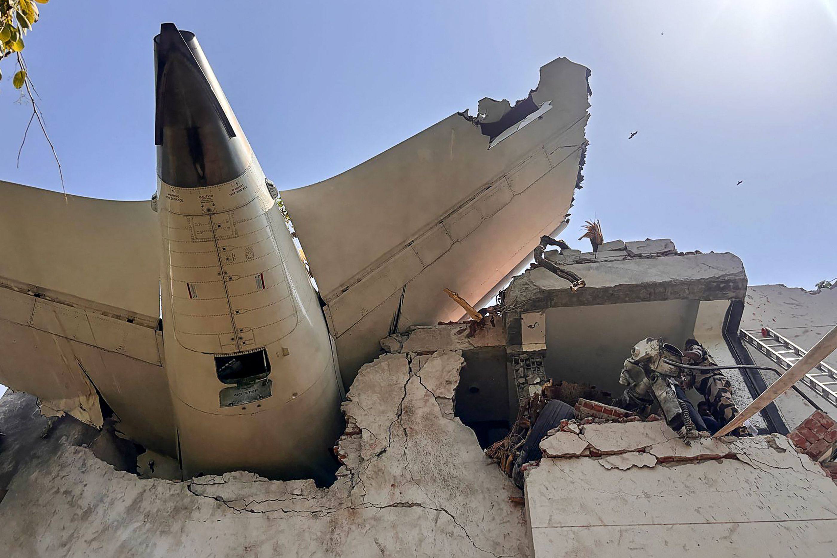 The rear of an Air India plane is seen after it crashed into residential buildings in Ahmedabad shortly after take-off on June 12. Photo: Central Industrial Security Force / AFP