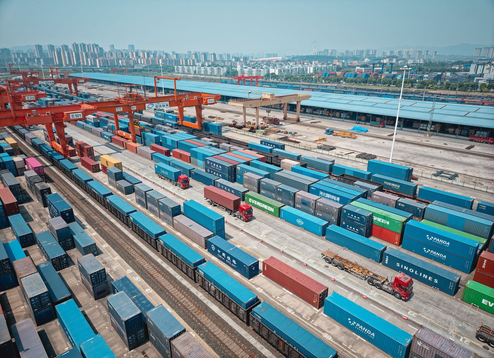 Trucks and trains carrying containers at the Chongqing Railway Container Center Station and New International Land-Sea Trade Corridor Dry Port, in the International Logistics Hub Park in Chongqing, China, May 20 2025. Photo: EPA-EFE/ALEX PLAVEVSKI Trucks and trains carrying containers at the Chongqing Railway Container Center Station and New International Land-Sea Trade Corridor Dry Port, in the International Logistics Hub Park in Chongqing, China, May 20 2025. Photo: EPA-EFE/ALEX PLAVEVSKI