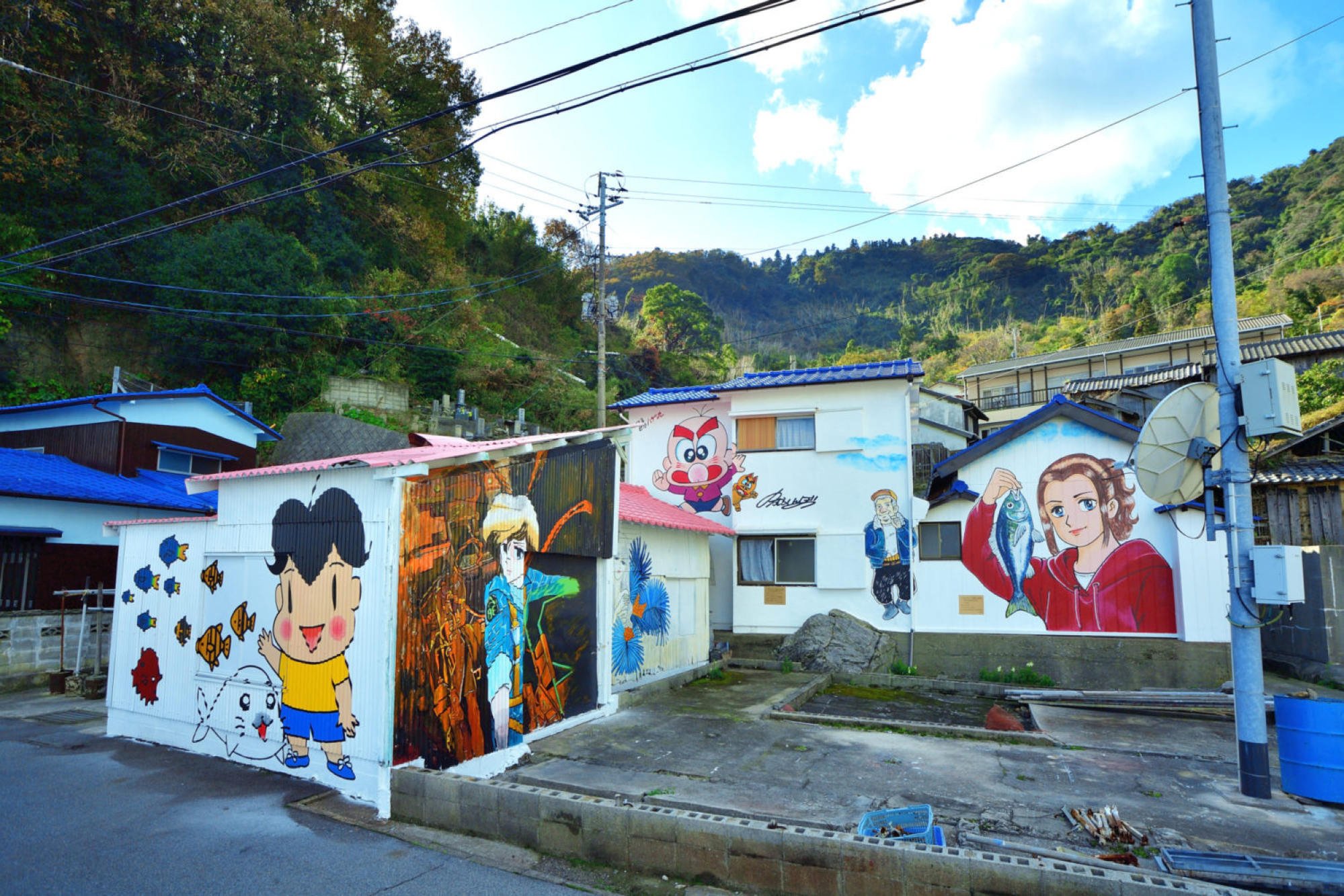 Buildings adorned with manga murals in Takaikamishima. Photo: Kamijima Town Tourism Office Buildings adorned with manga murals in Takaikamishima. Photo: Kamijima Town Tourism Office