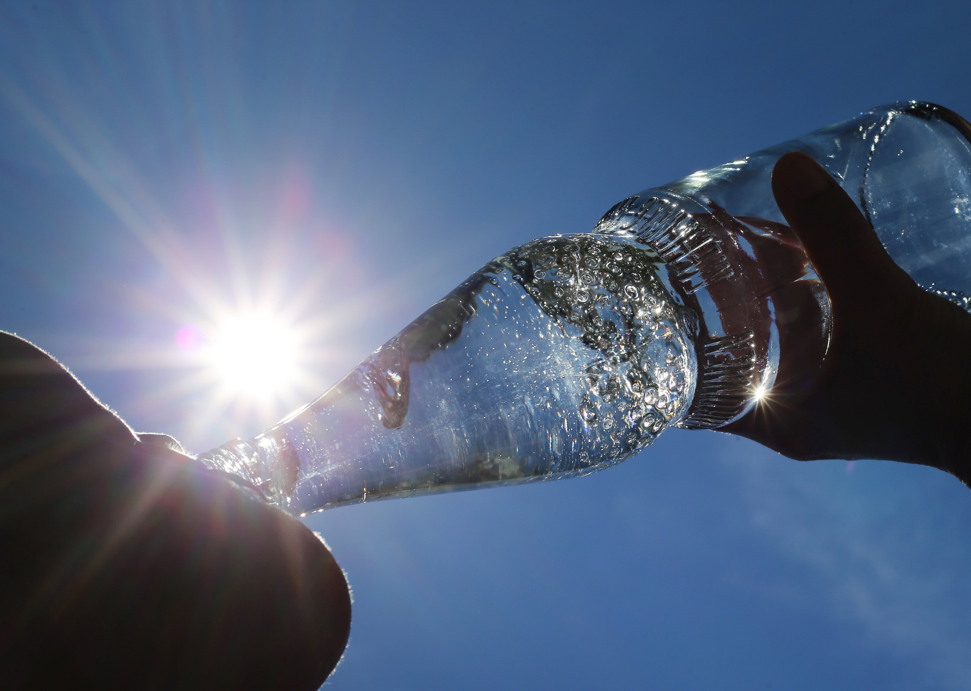 French study reveals glass bottled drinks contain more microplastics than plastic, due to cap friction. Photo: dpa