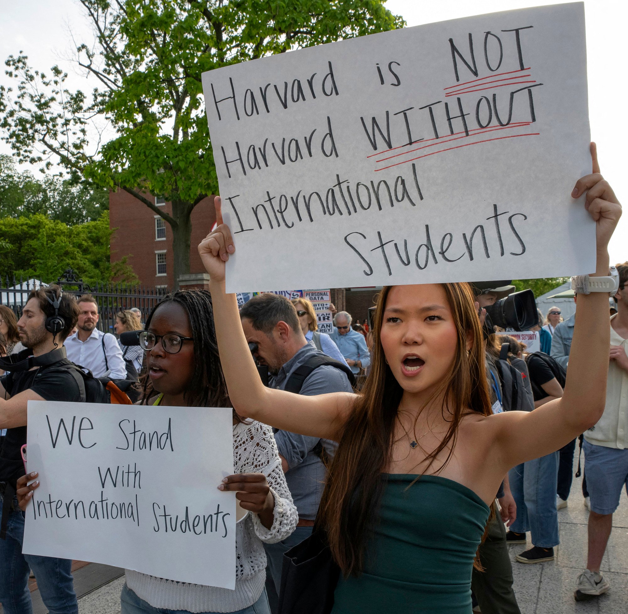 People hold up signs during the Harvard Students for Freedom rally in support of international students at the Harvard University campus in Boston, Massachusetts, on May 27. Photo: AFP People hold up signs during the Harvard Students for Freedom rally in support of international students at the Harvard University campus in Boston, Massachusetts, on May 27. Photo: AFP