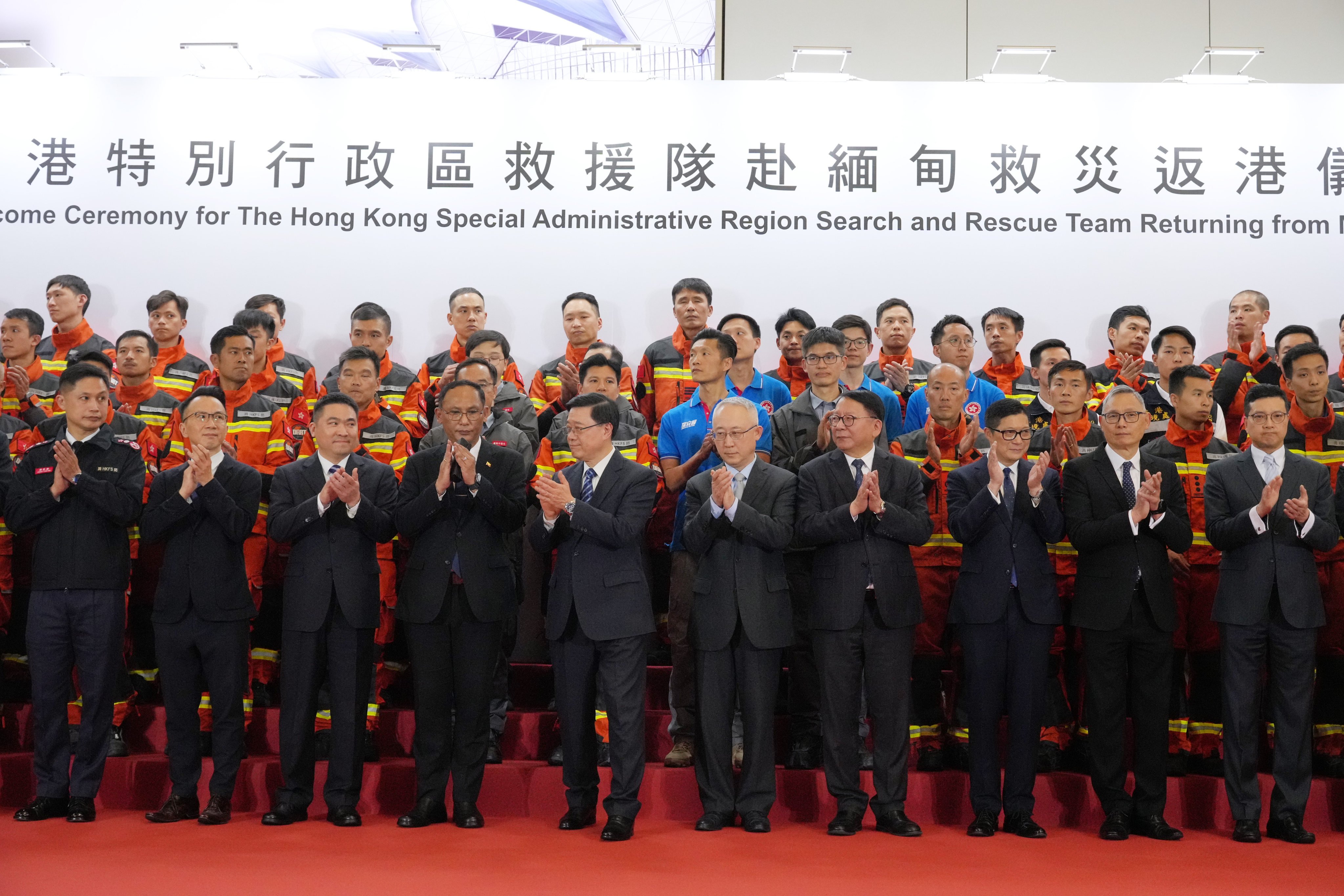 City leader John Lee (front row, fifth from left) and other officials welcome the returning Hong Kong rescue team at Hong Kong International Airport in early April, after its mission in the earthquake-affected areas of Myanmar. Photo: May Tse