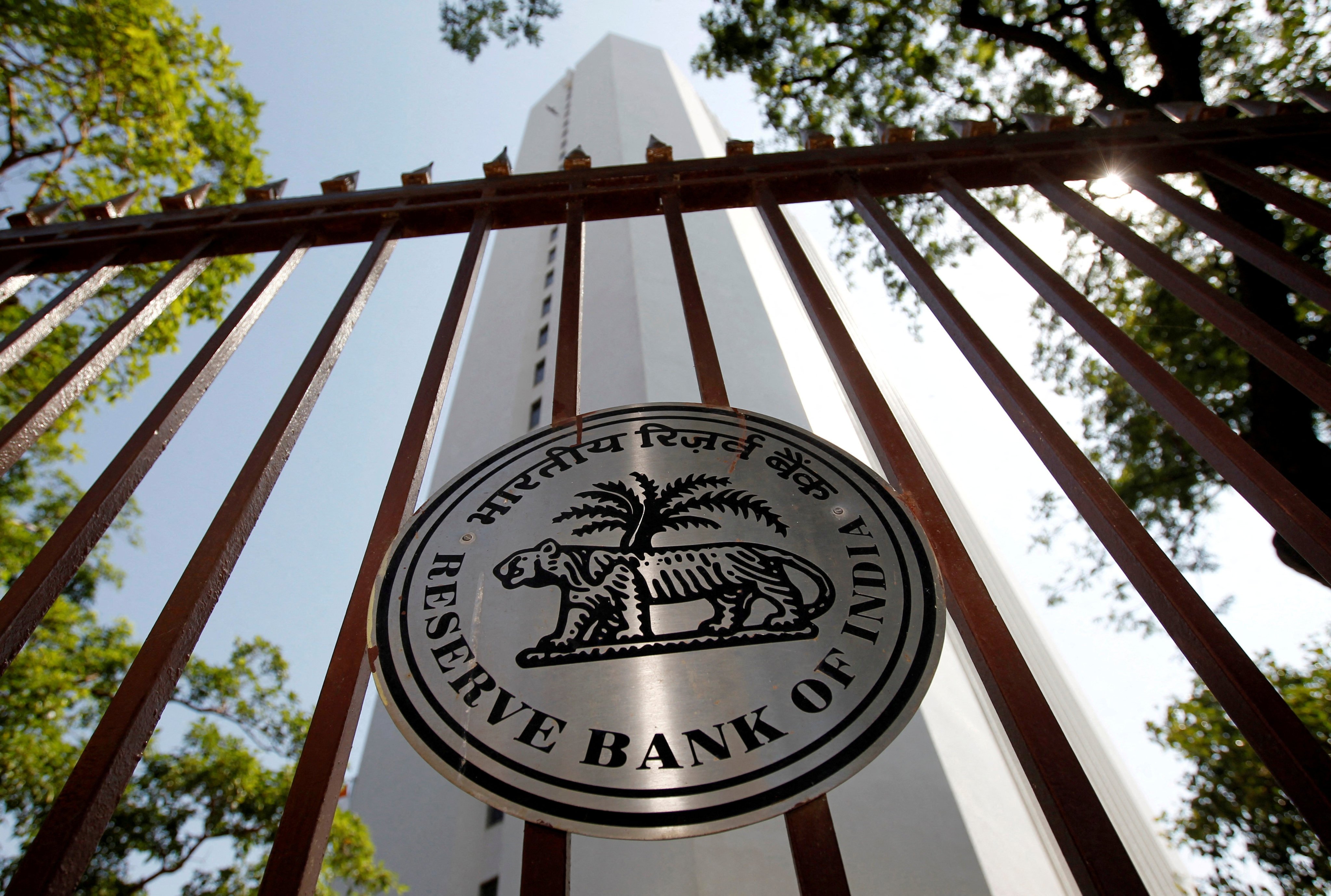 The Reserve Bank of India logo is seen outside its head office in Mumbai. The central banks of both India and Malaysia have reduced the size of some derivatives positions they use to weaken their currencies. Photo: Reuters
