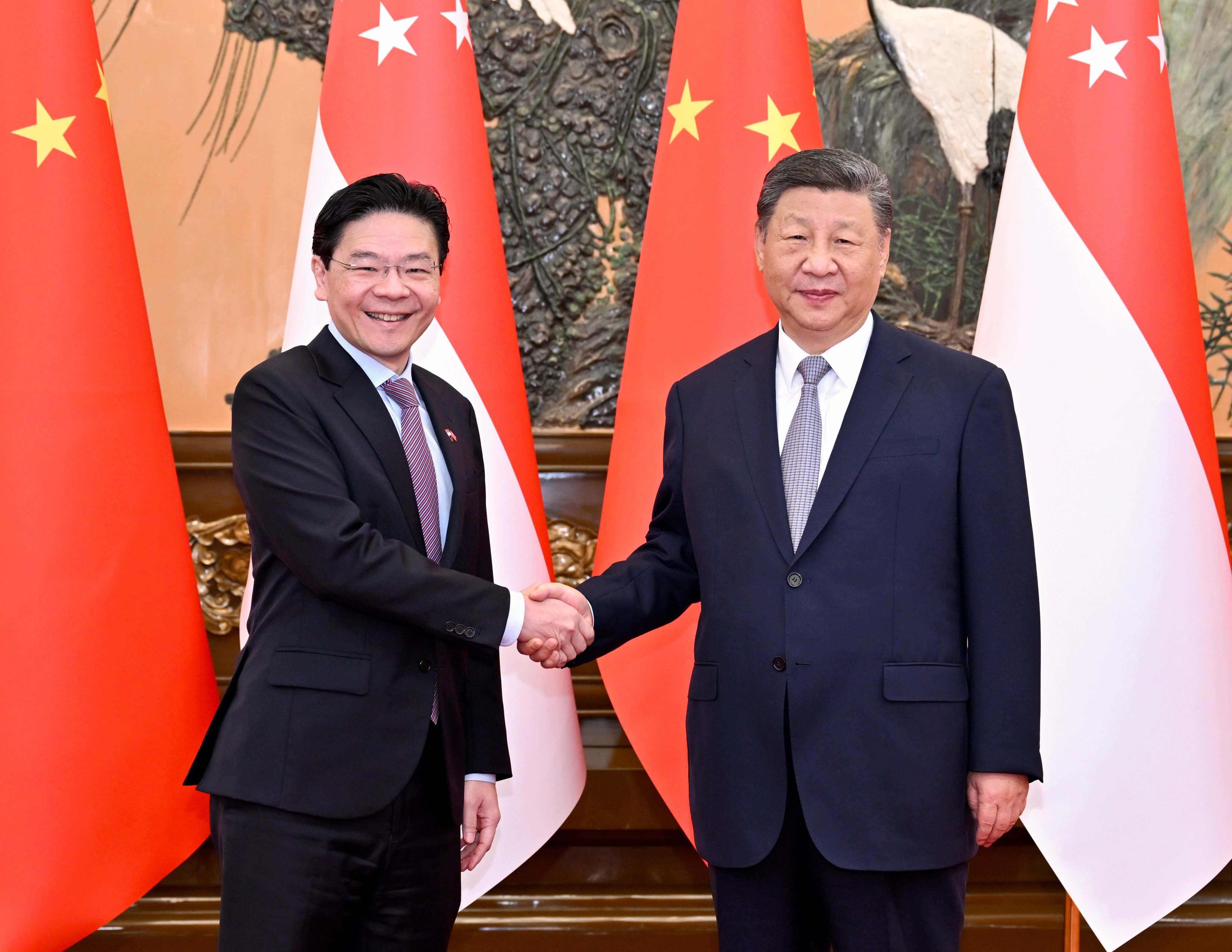 Chinese President Xi Jinping (right) met with Singaporean Prime Minister Lawrence Wong on Tuesday in Beijing. It is Wong’s first trip to China since he became prime minister in May last year. Photo: Xinhua