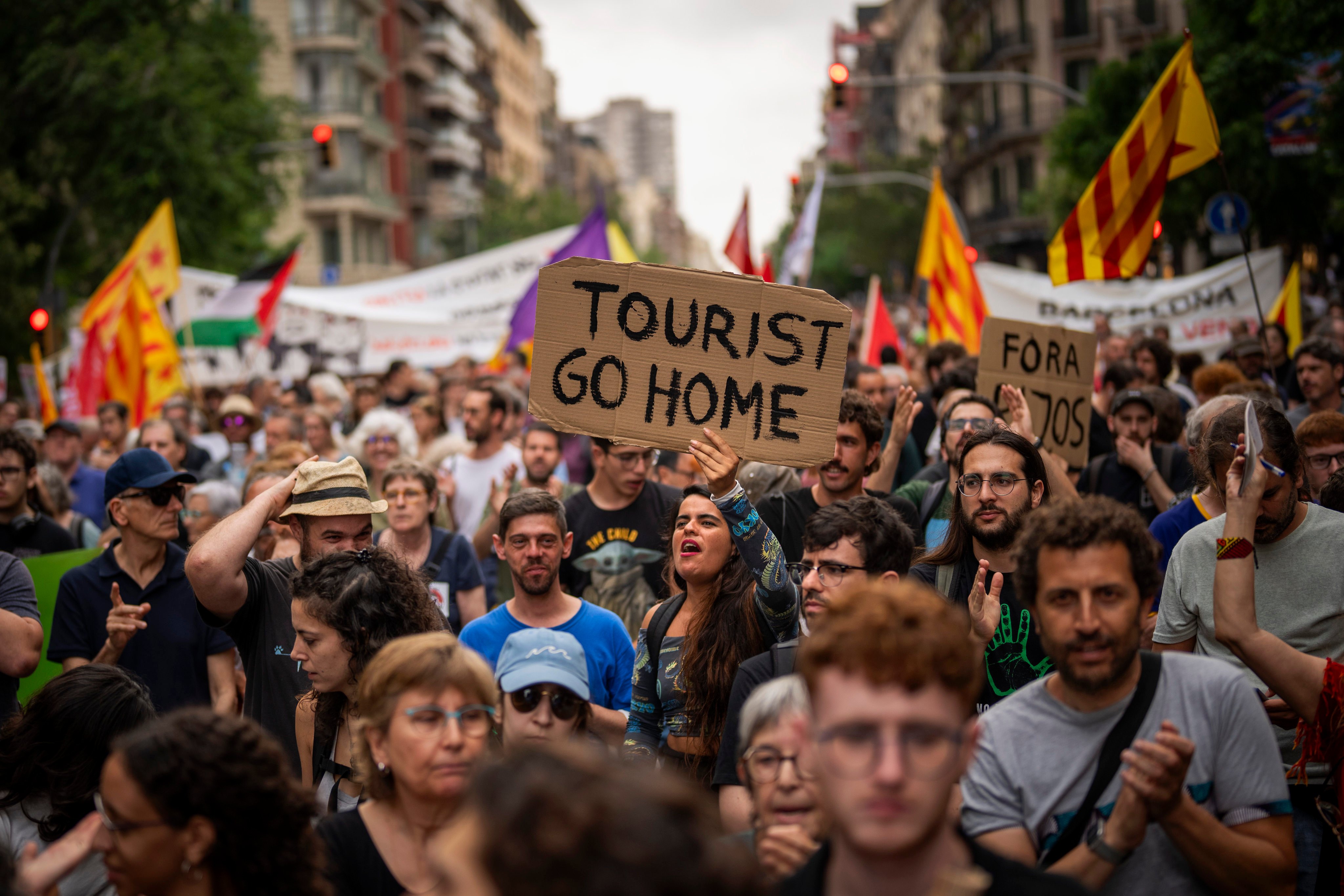 People demonstrate during a protest against overtourism in Barcelona in June 2024. The Spanish city remains at the forefront of a problem in Europe that shows little sign of ending. Photo: AP