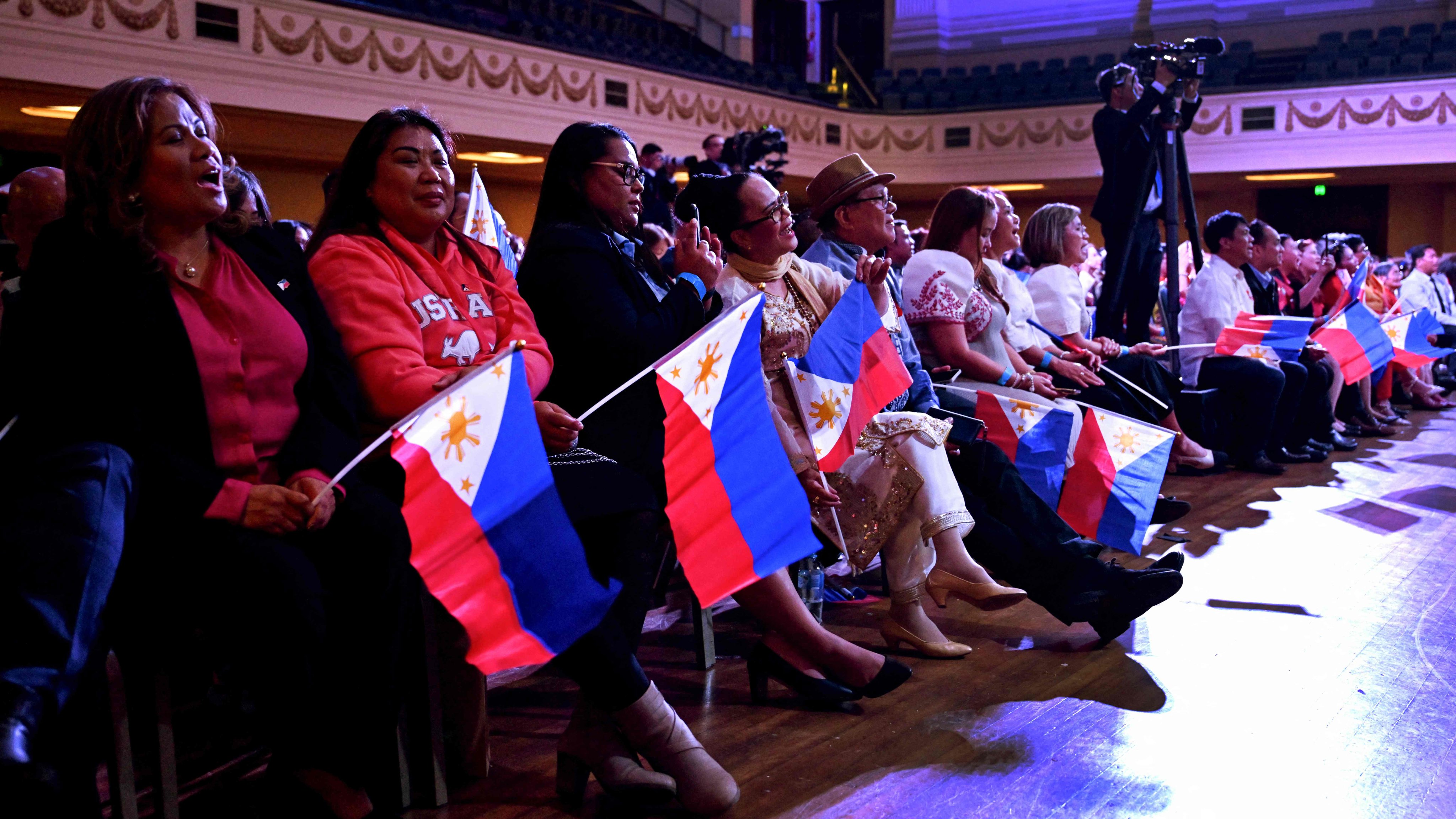 Filipinos in Australia listen to Philippine President Ferdinand Marcos Jnr during an event in Melbourne last year. Photo: AFP