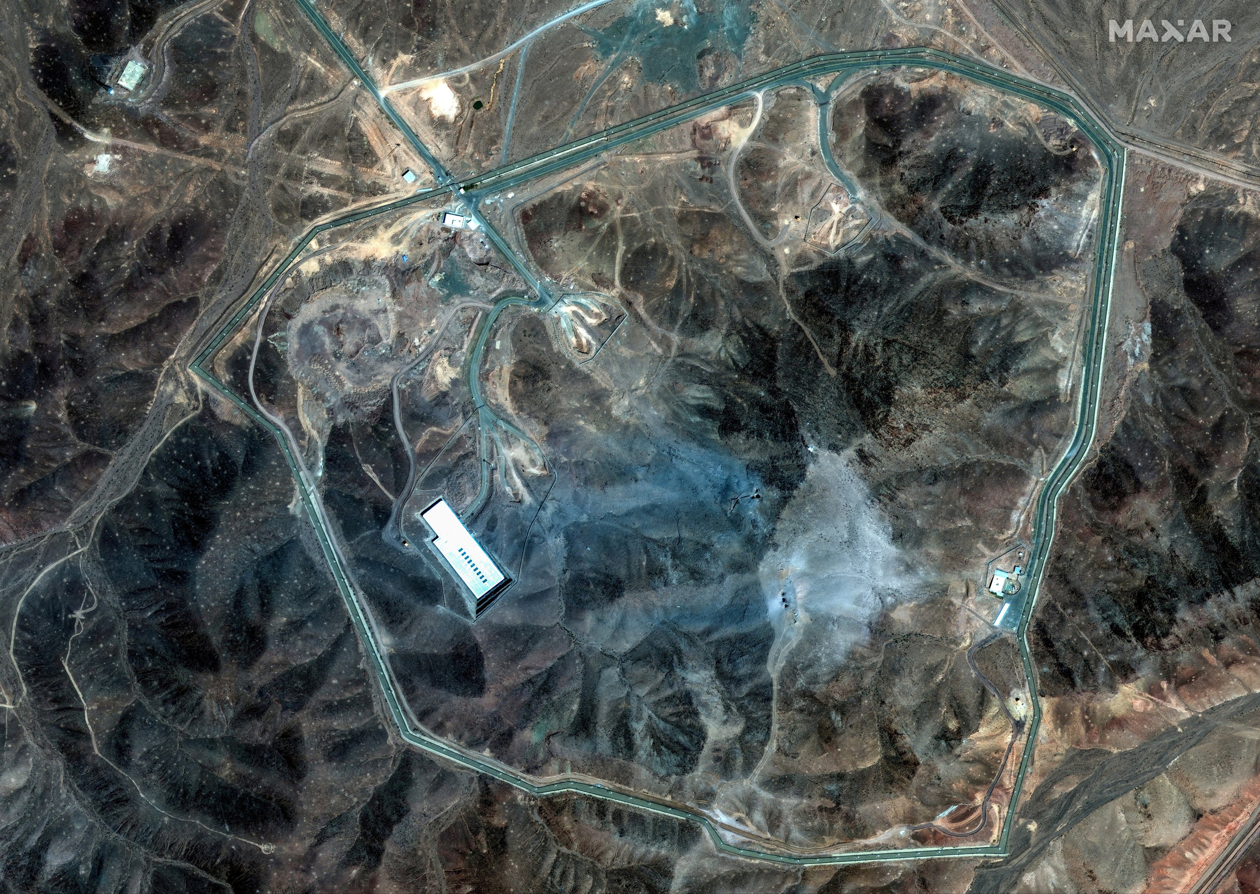 A satellite image shows an overview of Fordow underground complex after the US struck the underground nuclear facility, near Qom, Iran, on Sunday. Image: Maxar Technologies via Reuters